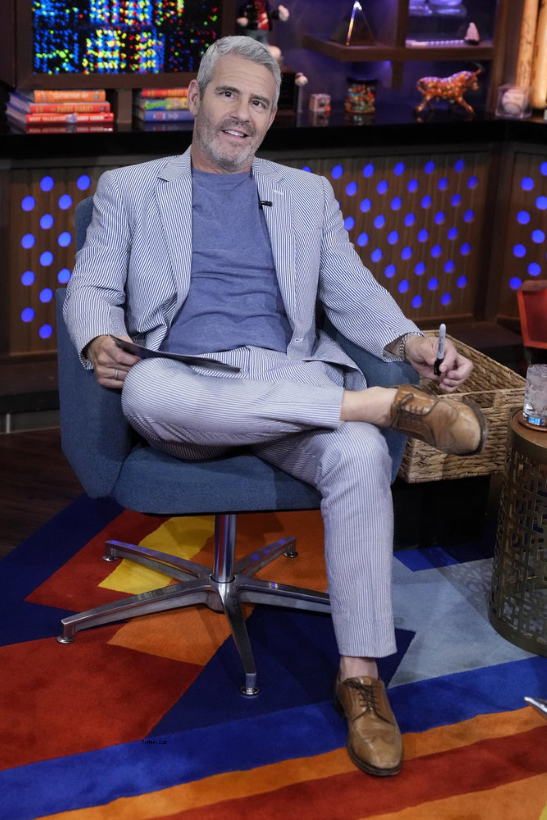 Andy Cohen being hit with a bottle on 