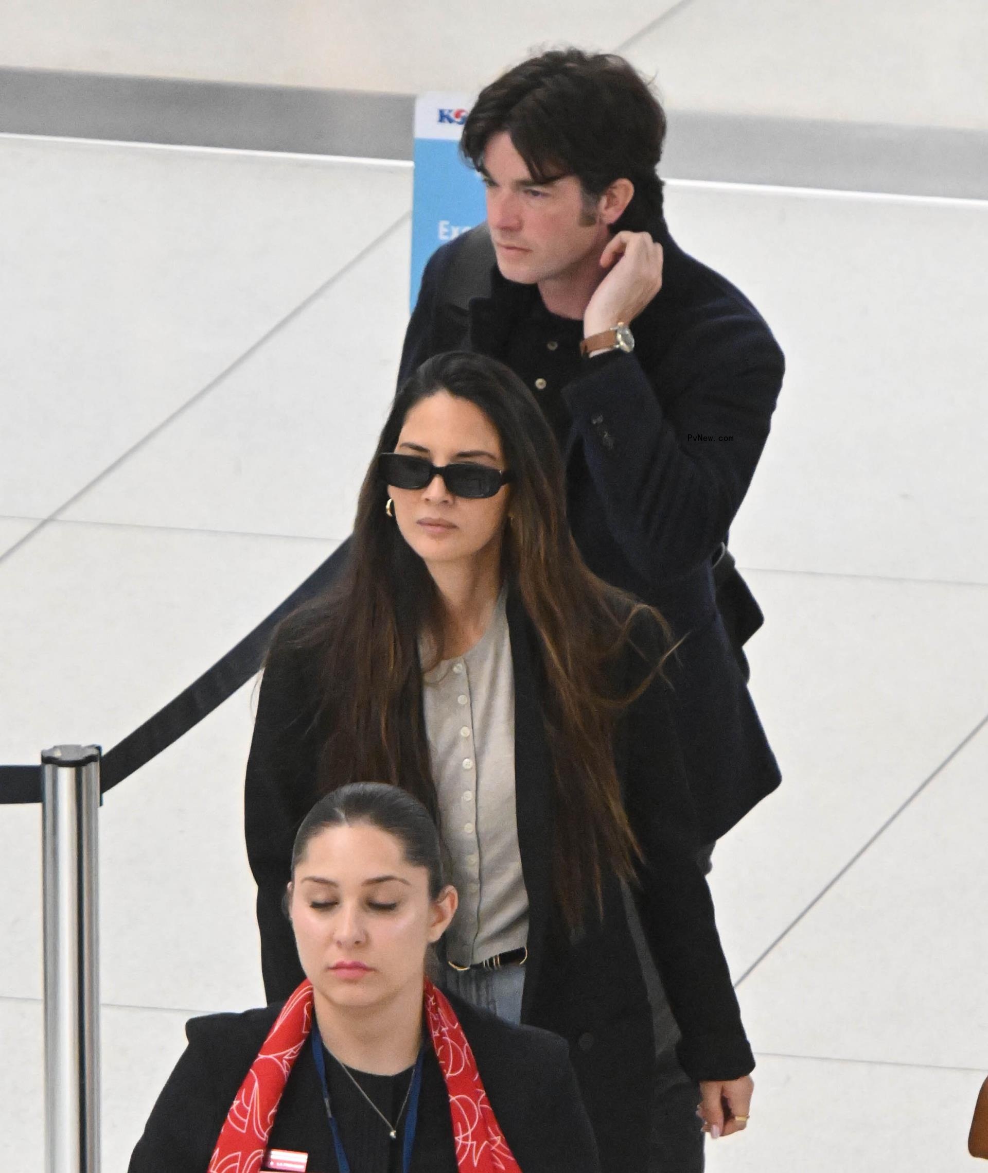 John Mulaney and Olivia Munn at JFK Airport. 