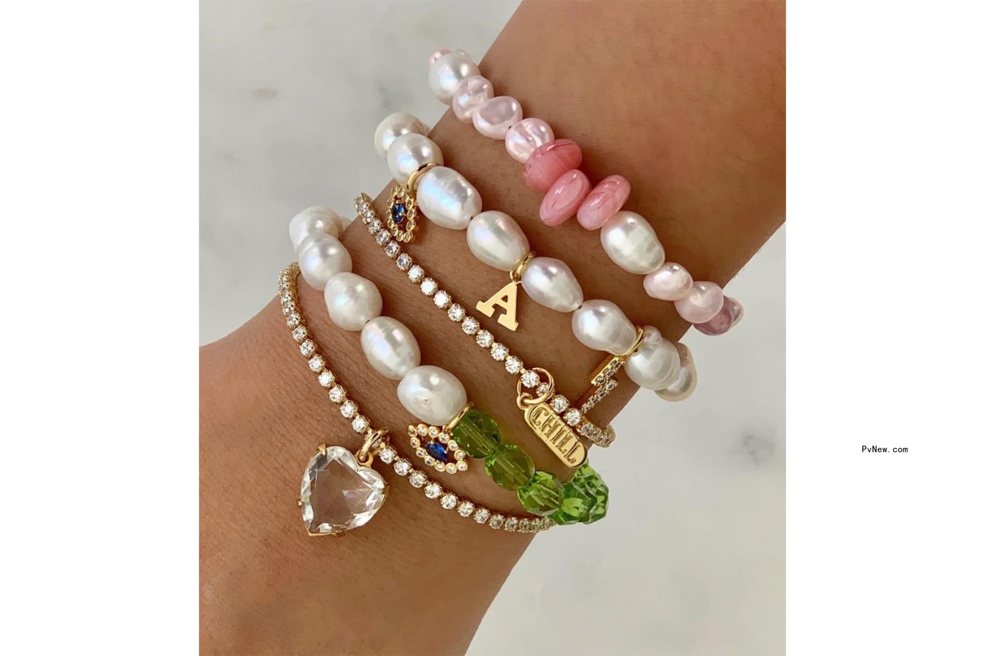 An arm with a stack of bracelets on it
