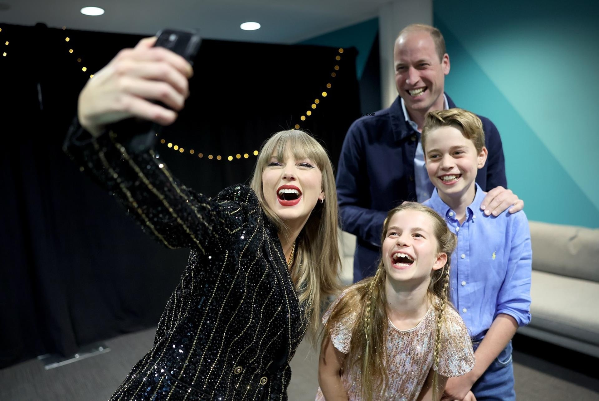 Taylor Swift taking a selfie with Prince William and his kids.