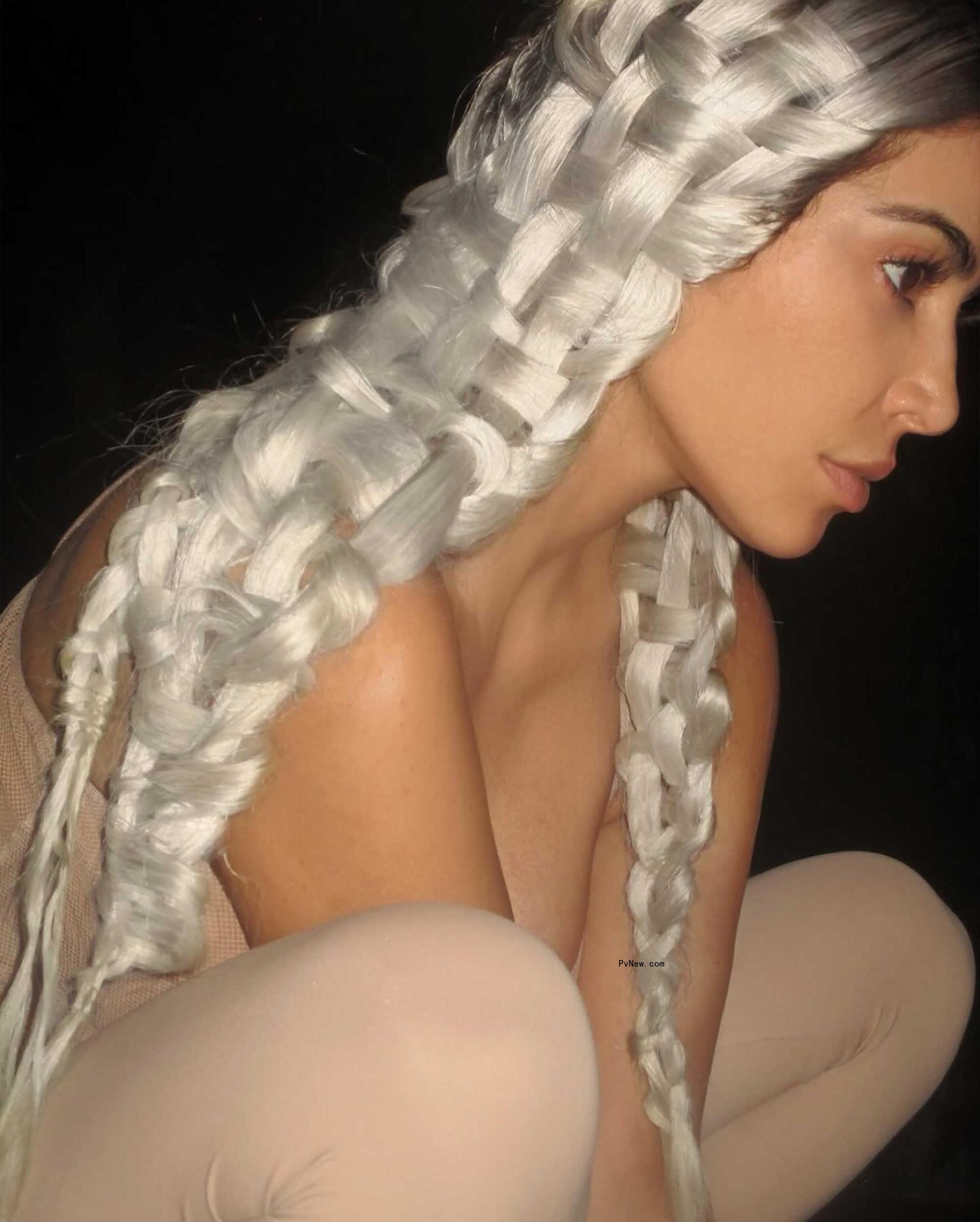 Kim Kardashian wearing a woven hairdo. 