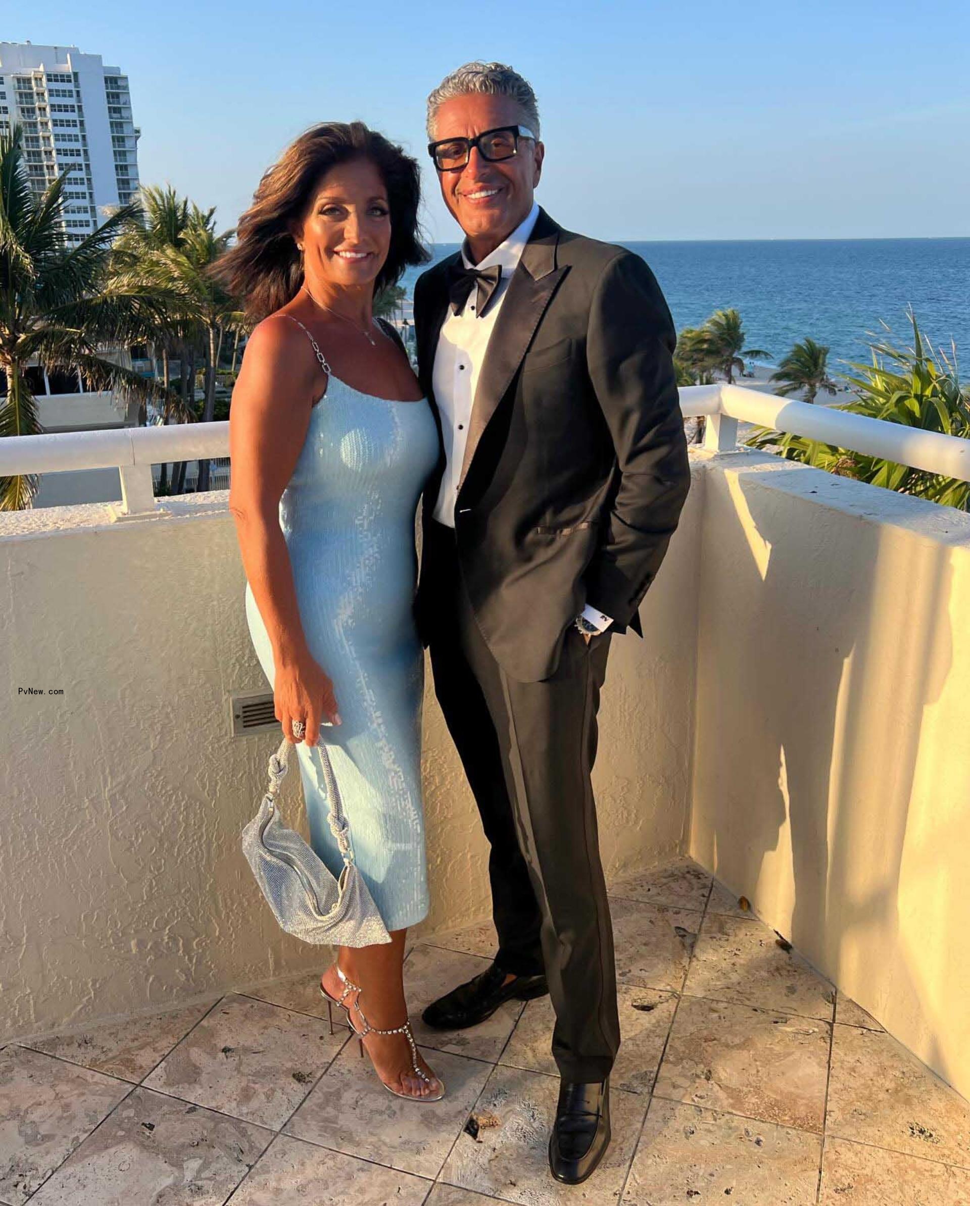 Kathy and Rich Wakile posing together 