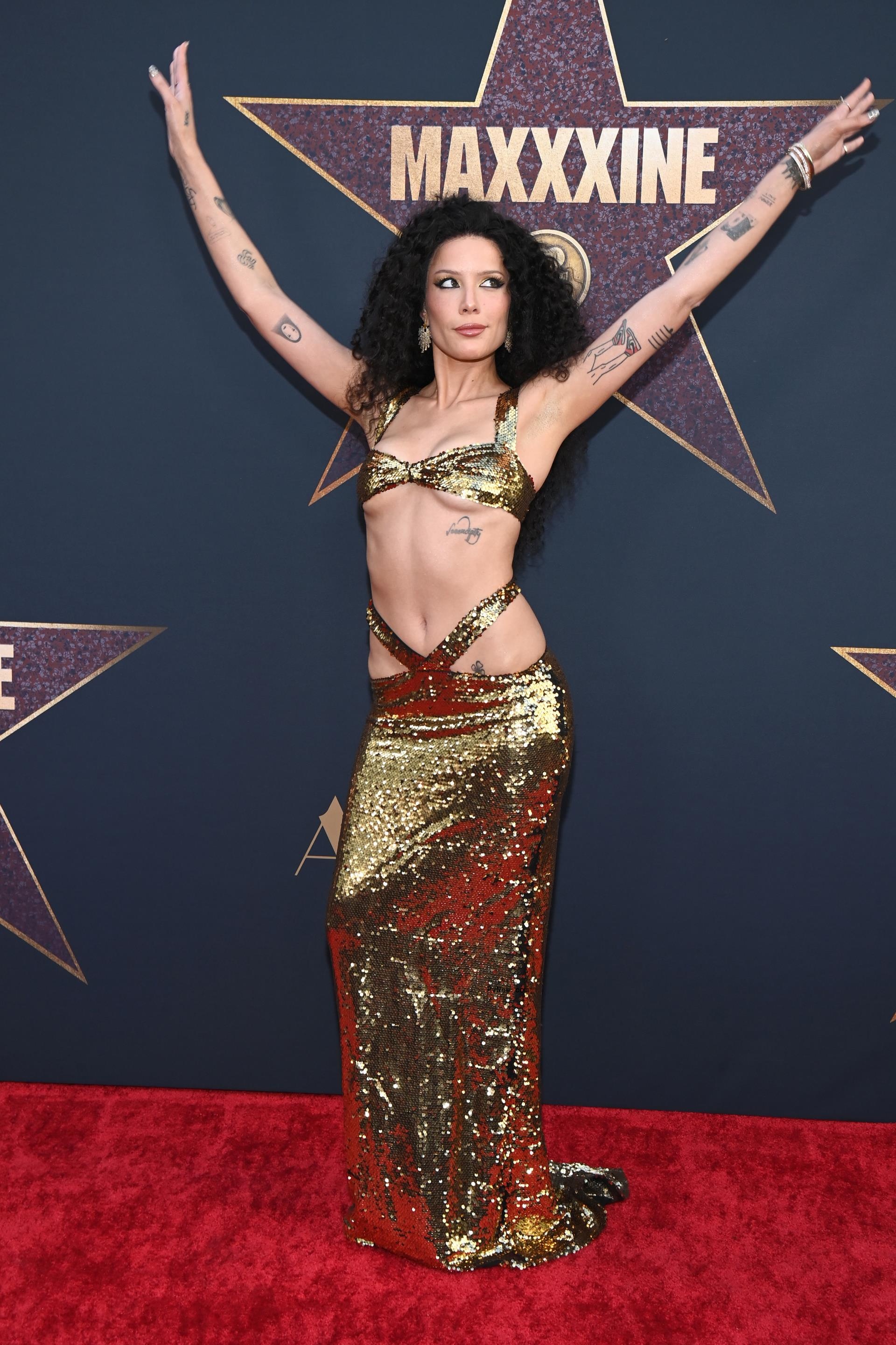 Halsey wears a gold dress to the 