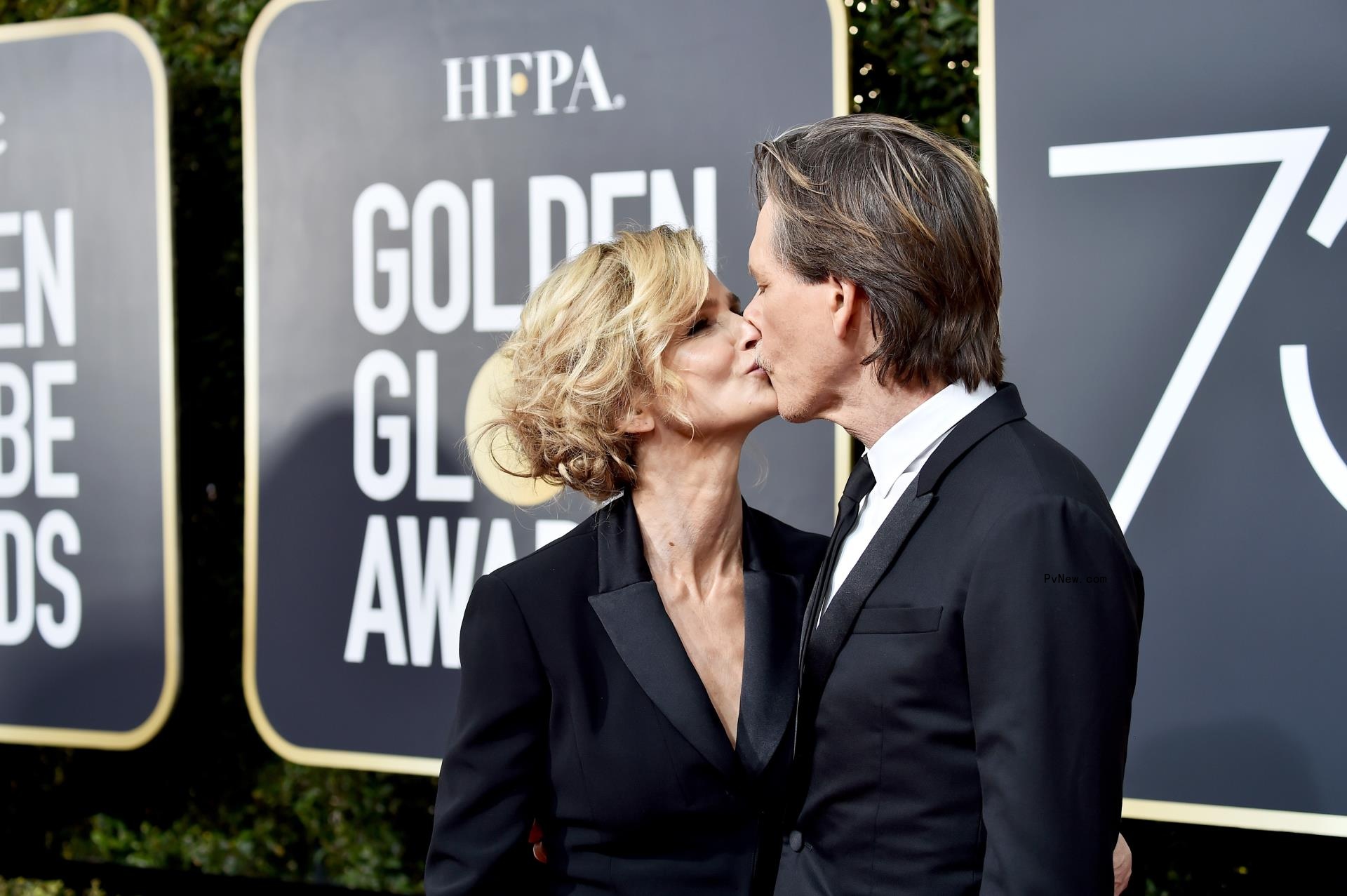 Kyra Sedgwick and Kevin Bacon kissing
