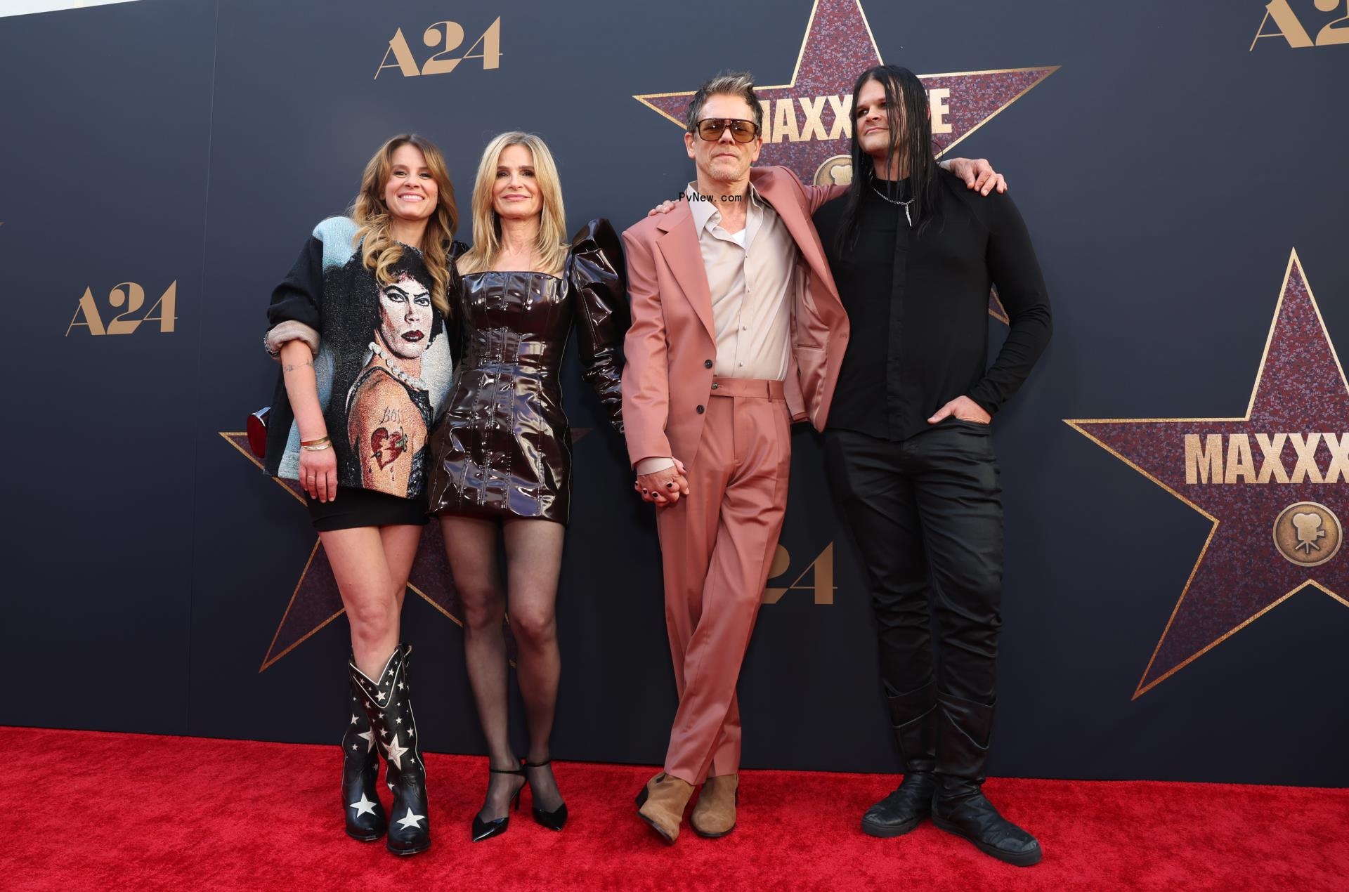 Sosie Bacon, Kyra Sedgwick, Kevin Bacon and Travis Bacon posing on a red carpet