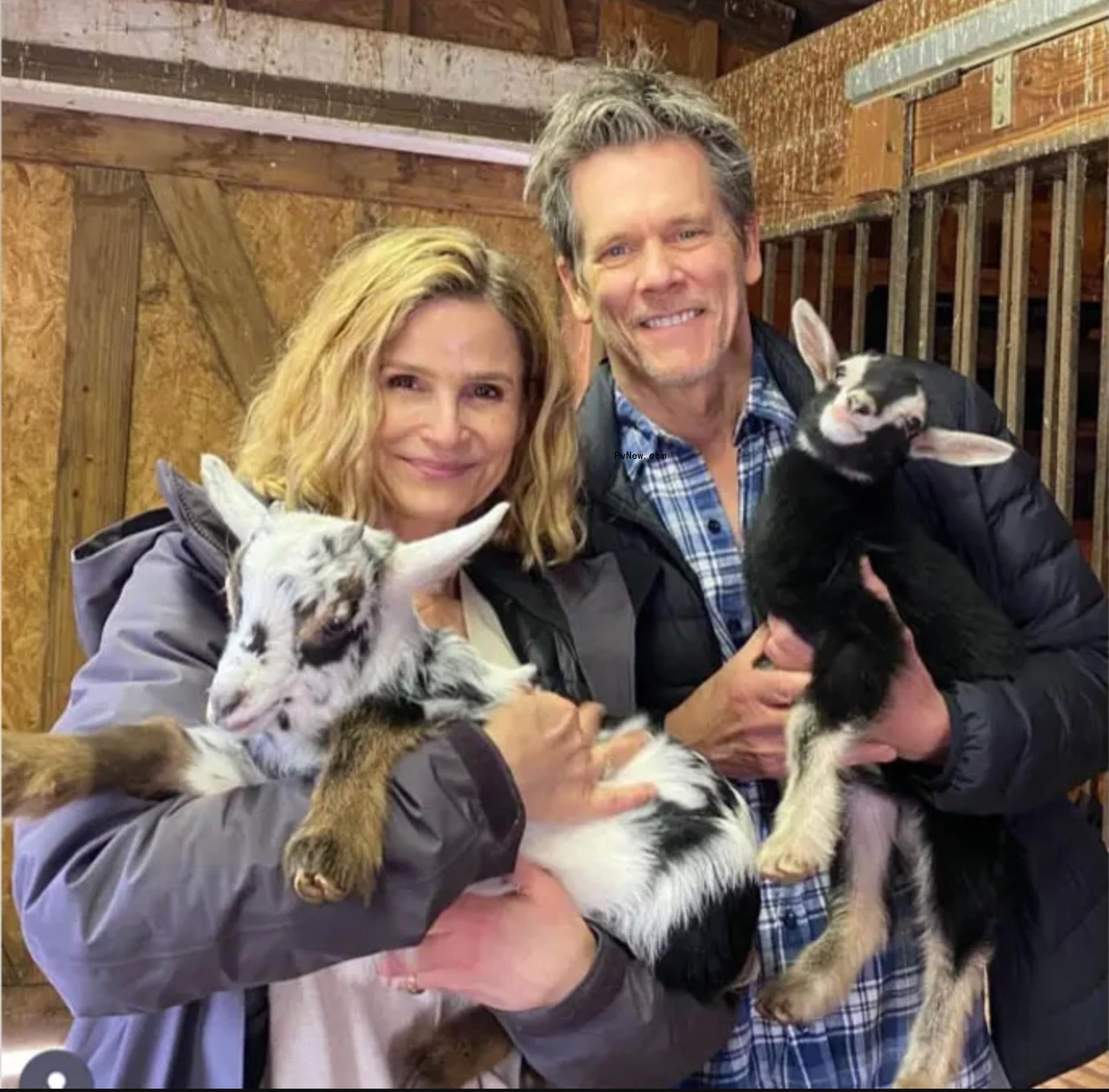 Kyra Sedgwick and Kevin Bacon  posing together
