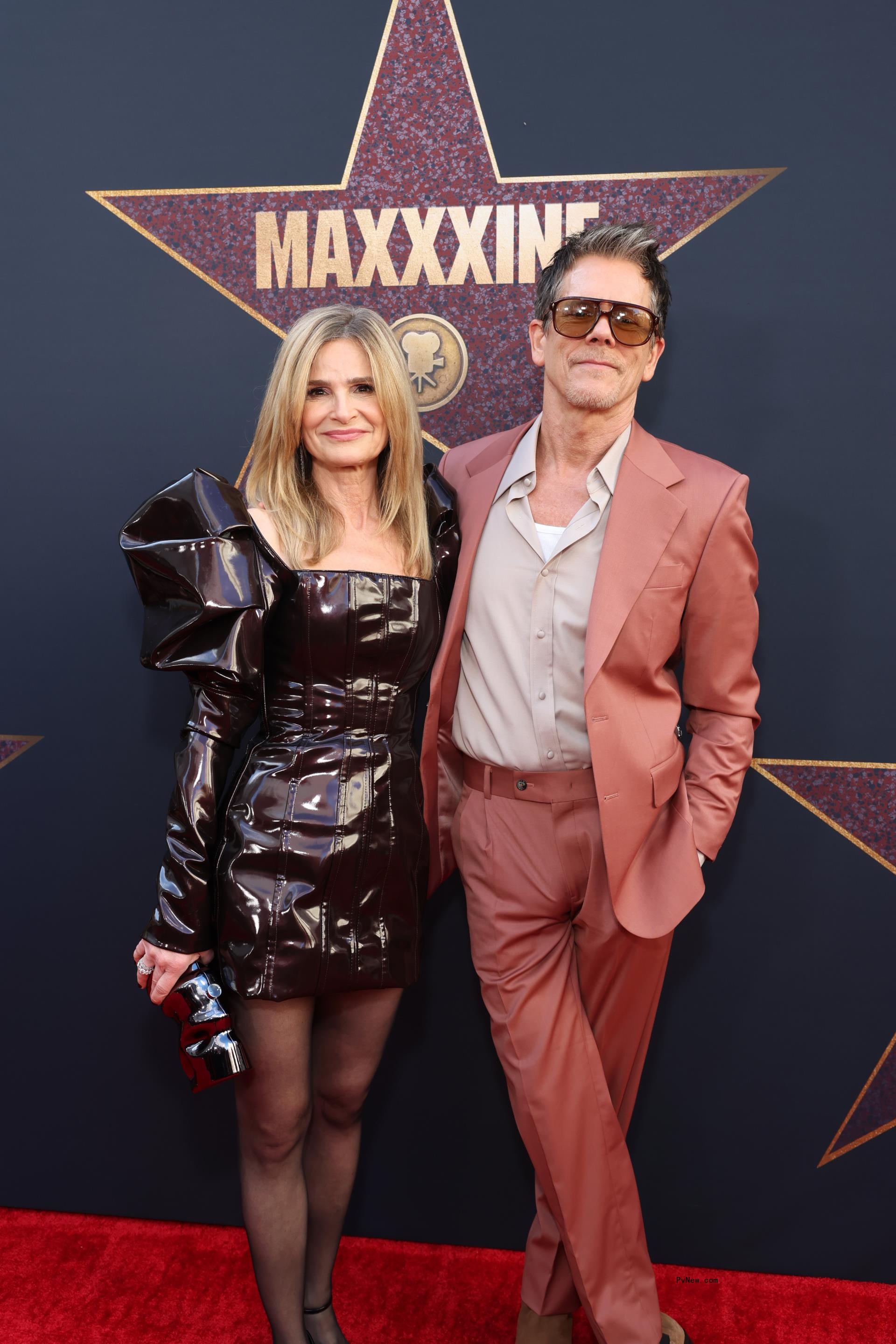 Kyra Sedgwick and Kevin Bacon posing together