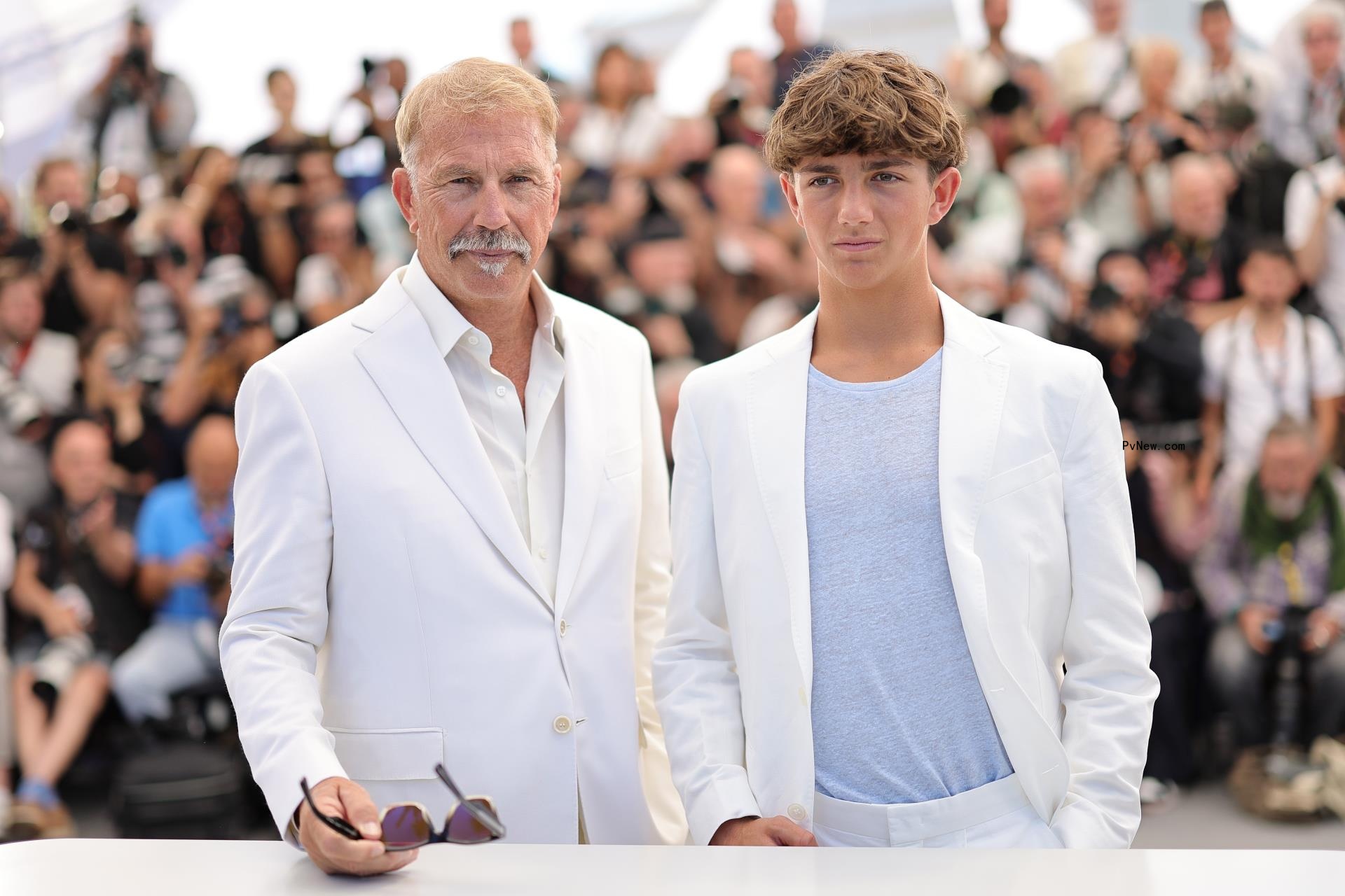 Kevin Costner and Hayes Costner posing together