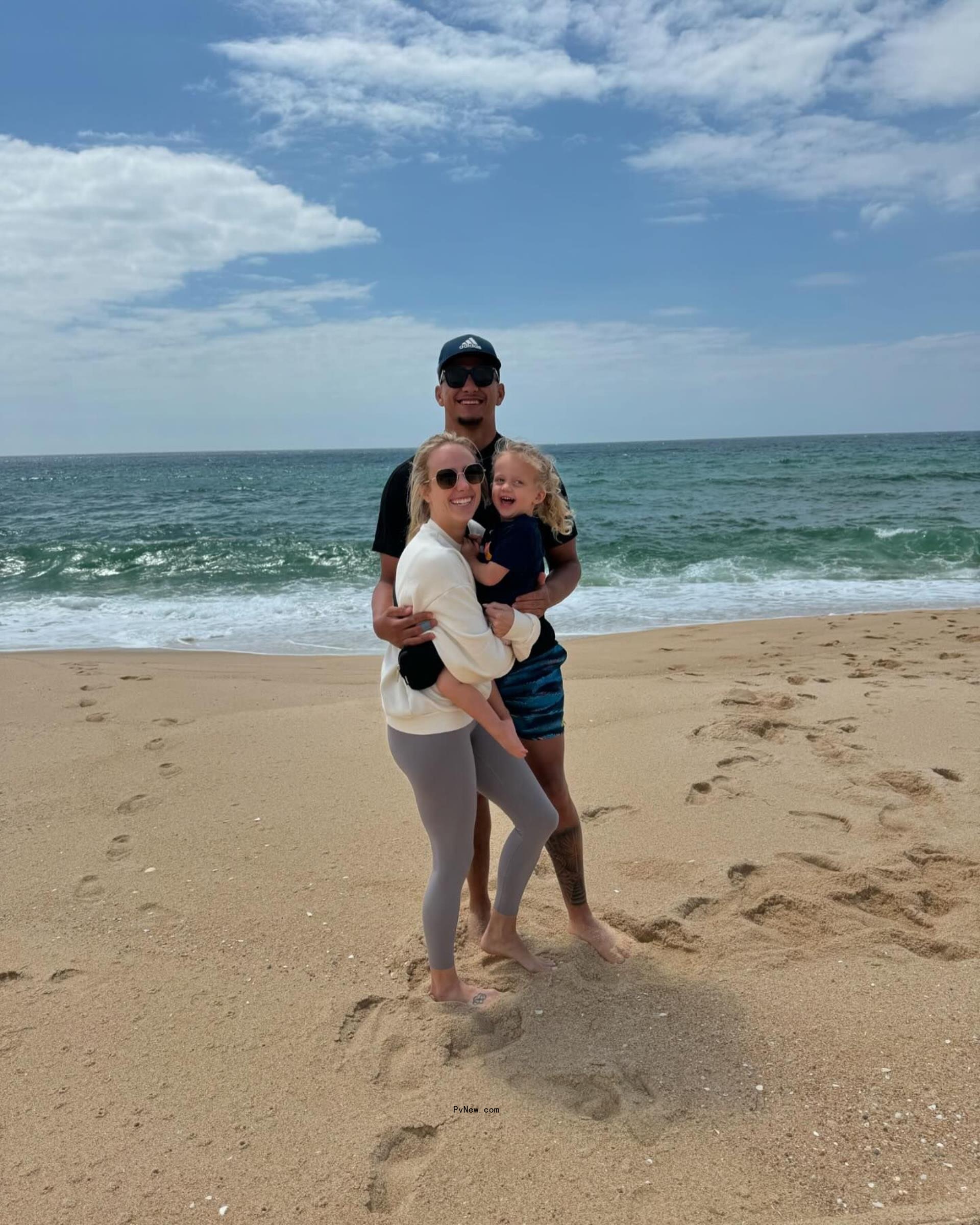 patrick and brittany mahomes with their daughter on the beach