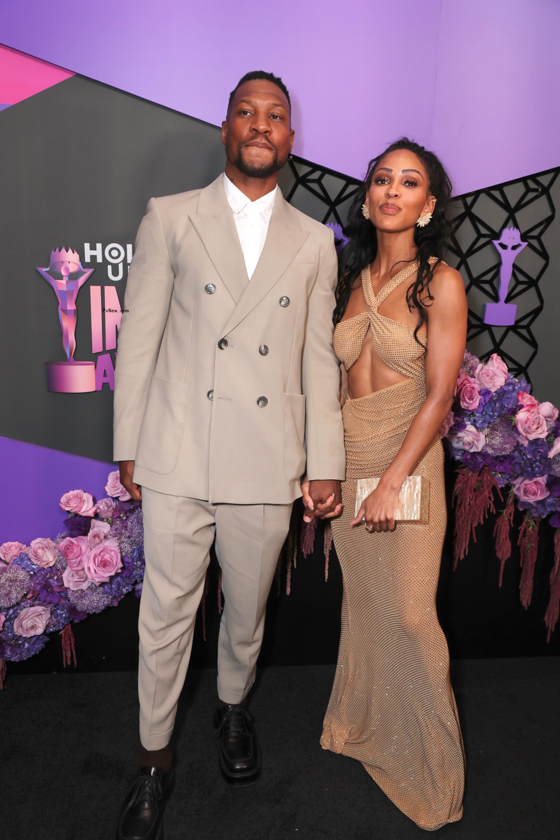 Jo<i></i>nathan Majors and Meagan Good posing together