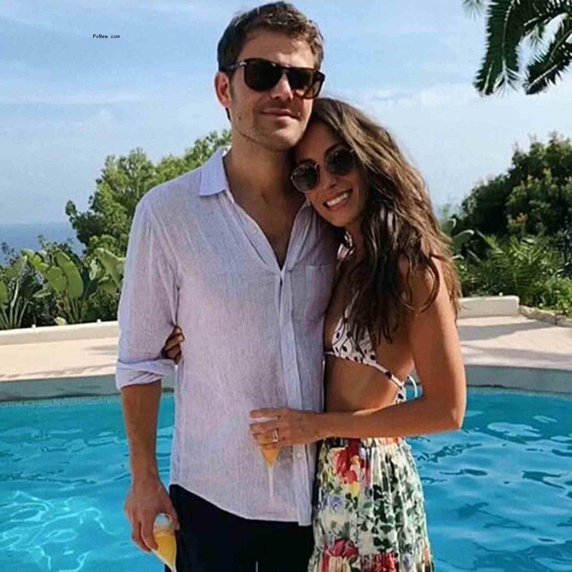 Ines de Ramon and Paul Wesley by the pool. 