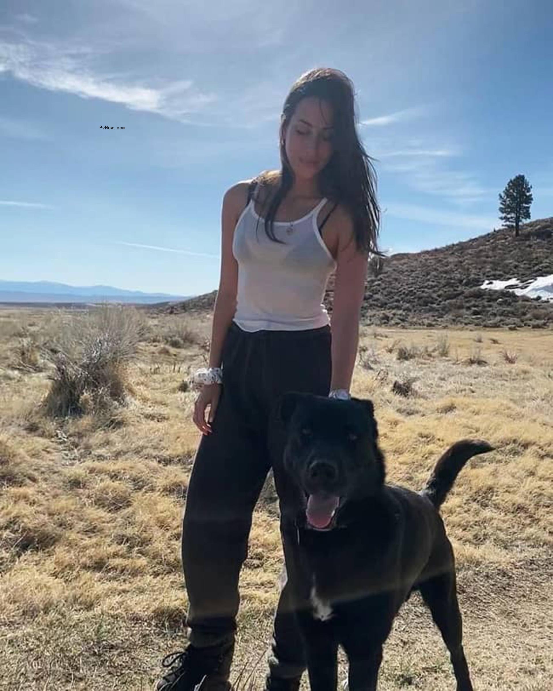Ines de Ramon on the beach with her dog. 
