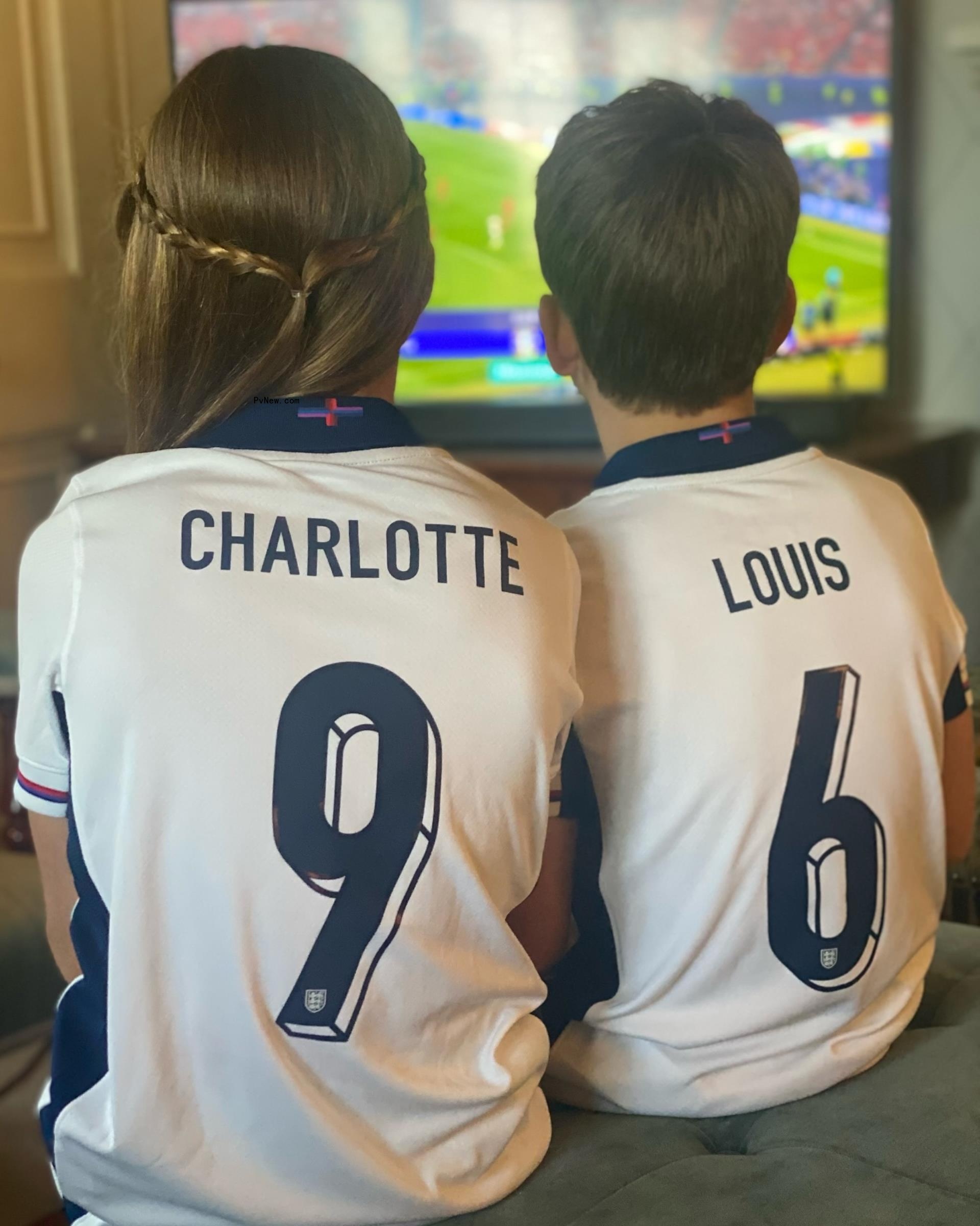 Princess Charlotte and Prince Louis watching a soccer game.
