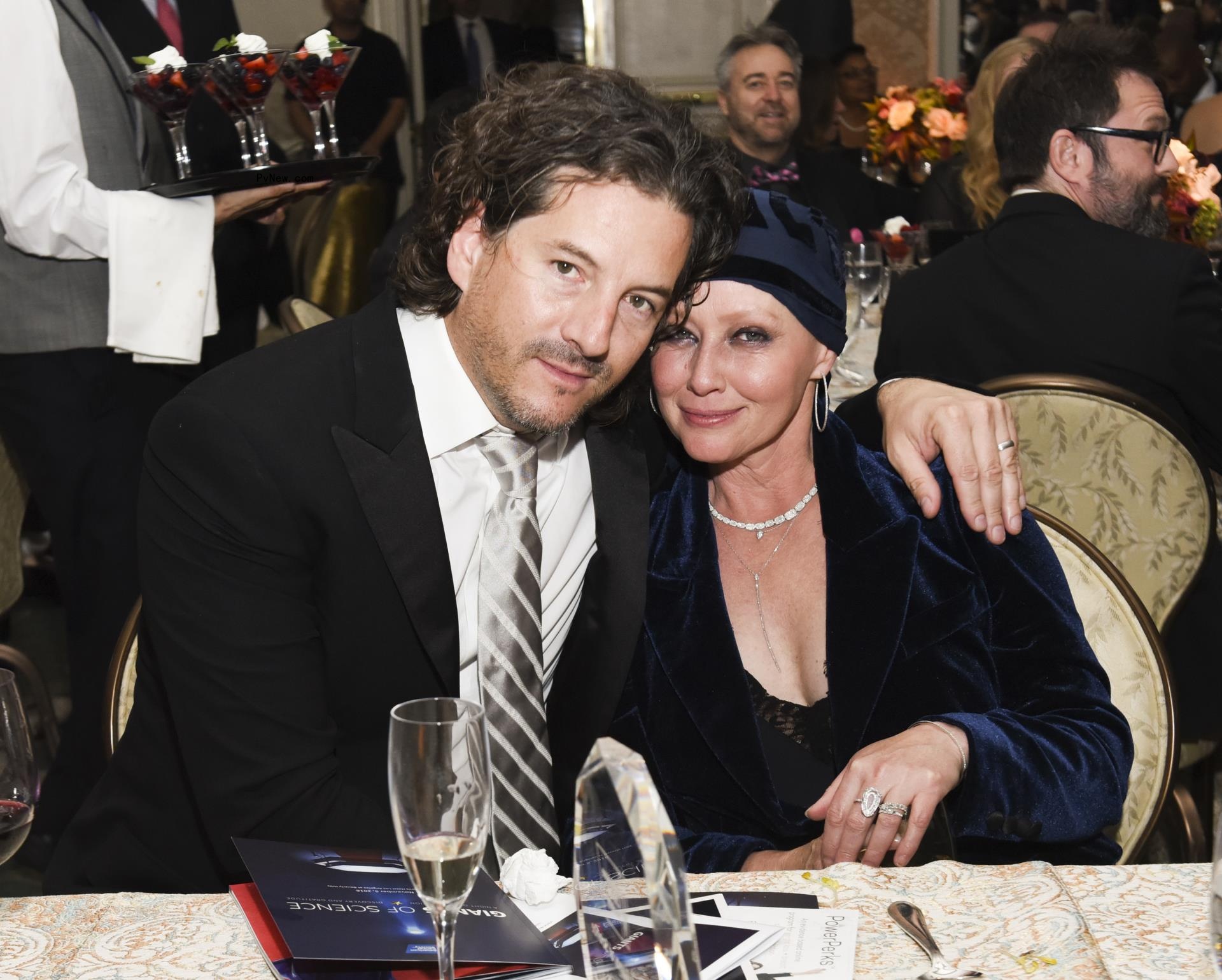 Kurt Iswarienko and actress Shannen Doherty sitting together