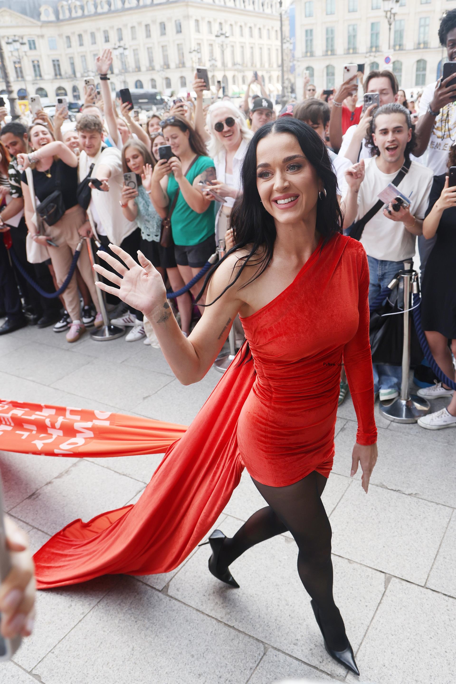 Katy Perry wearing a red dress with