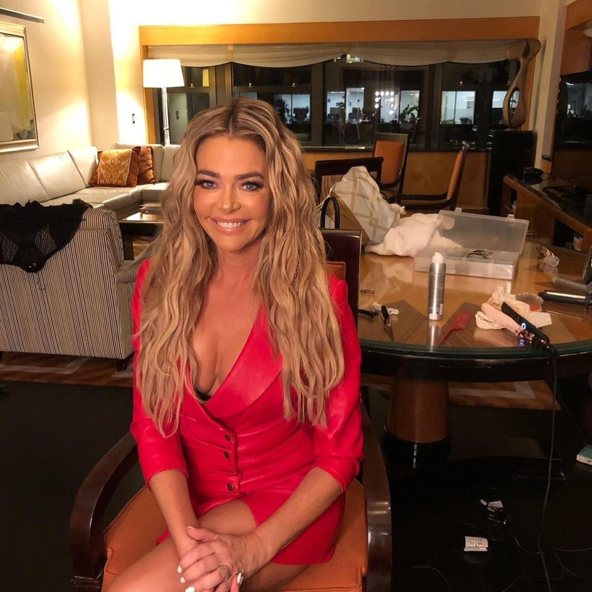 Denise Richards in a chair. 