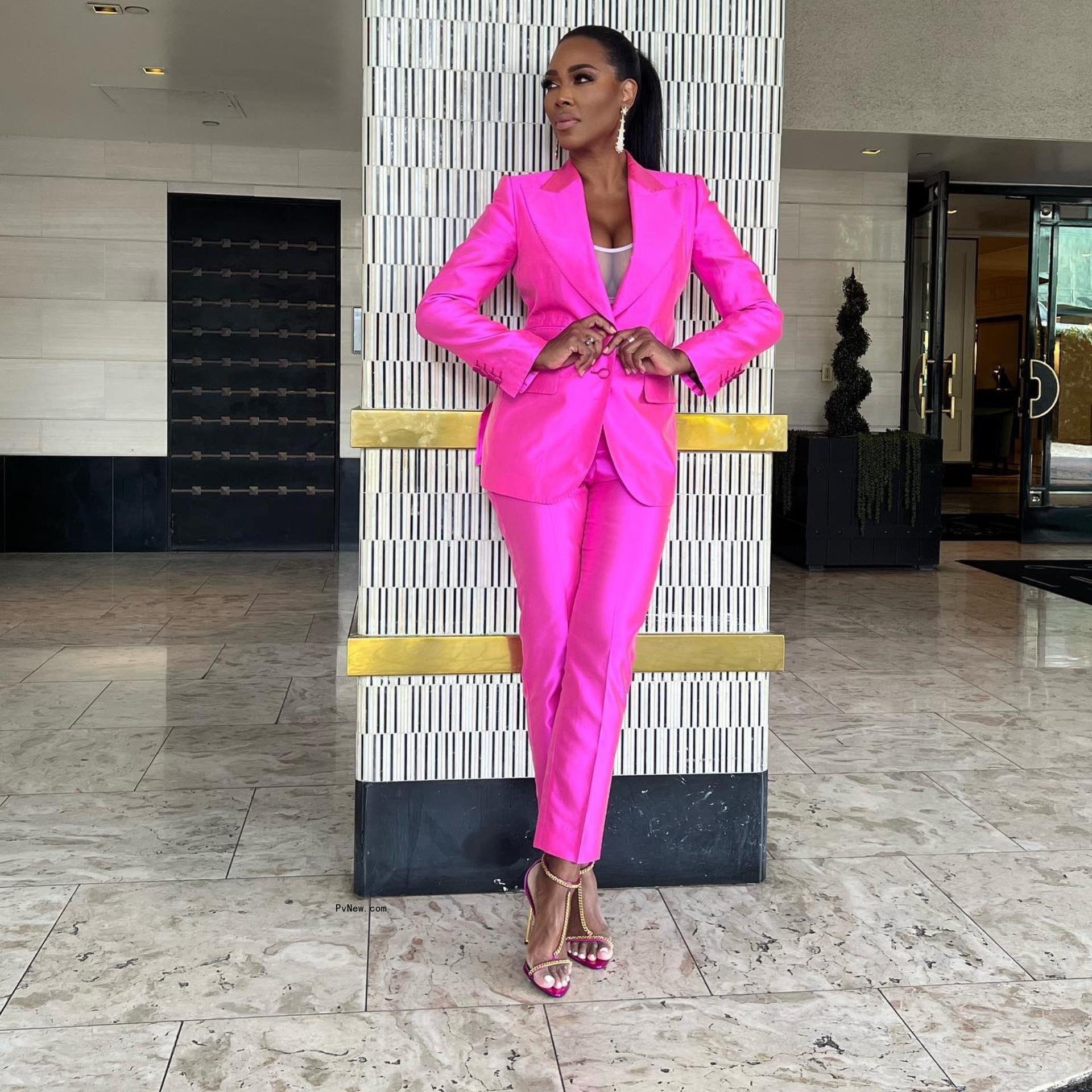 Kenya Moore in a pink suit.