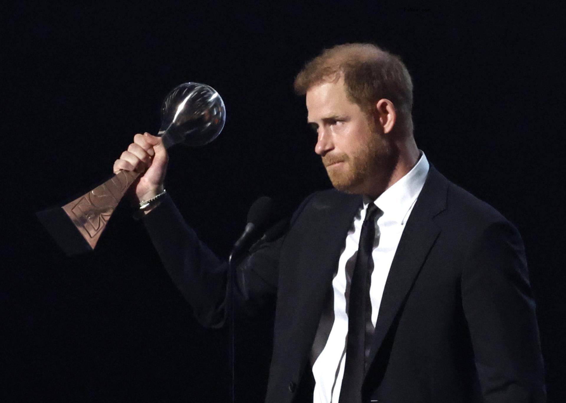 Prince Harry holding an award at the ESPYs 2024