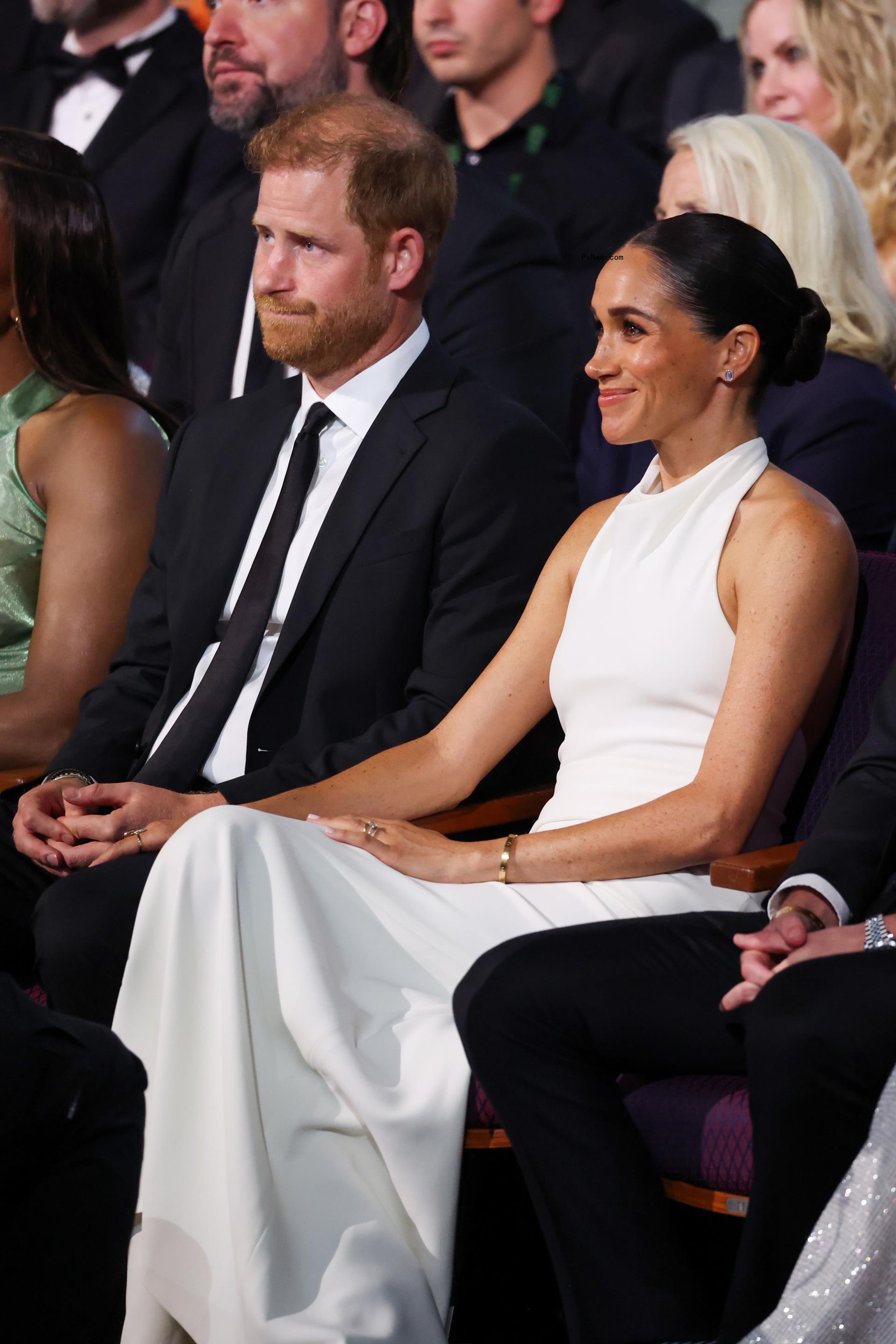 Prince Harry and Meghan Markle sitting together