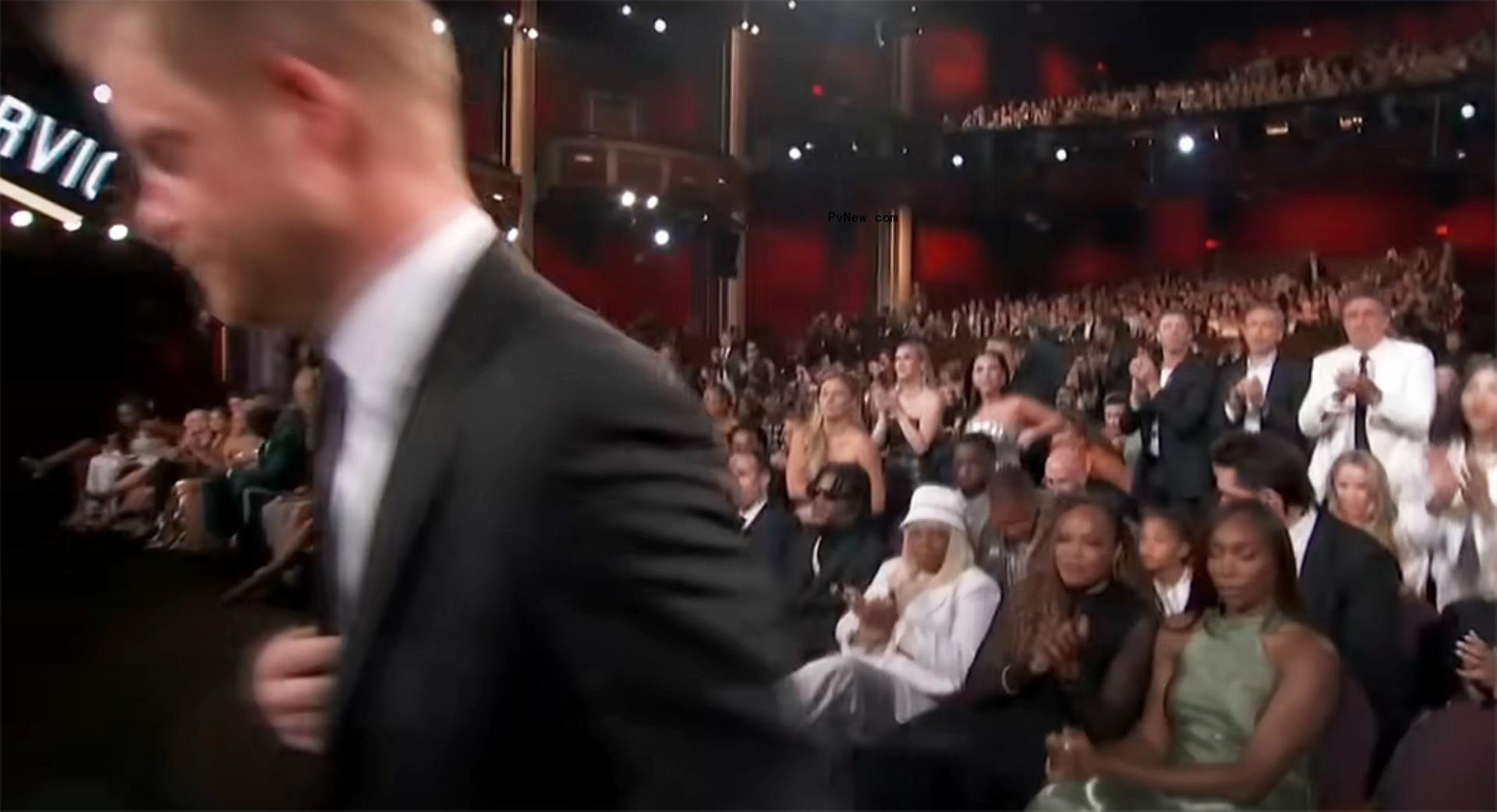 Prince Harry walking and Venus Williams sitting down