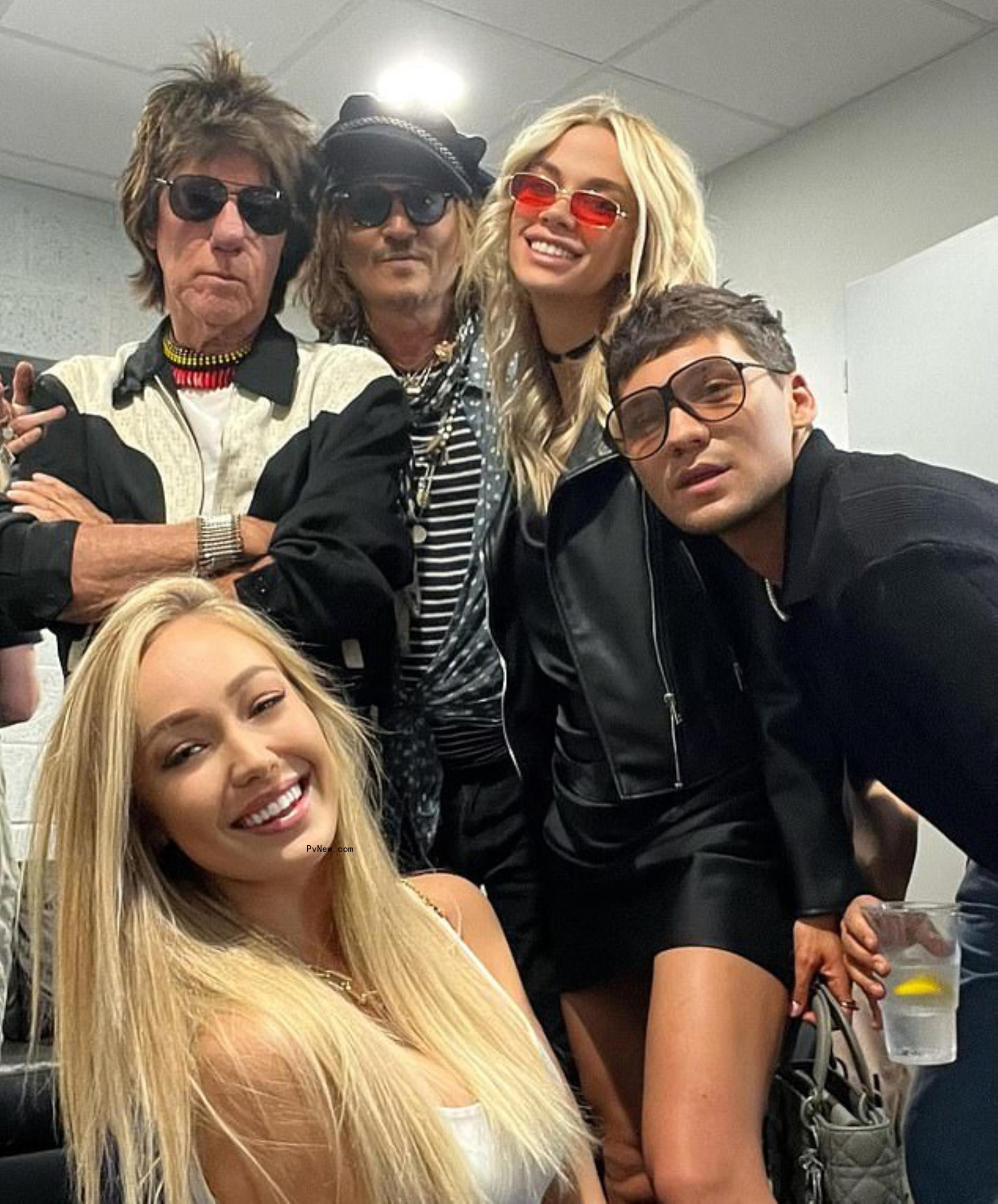 Johnny Depp, Yulia Vlasova and friends at Jeff Beck's concert
