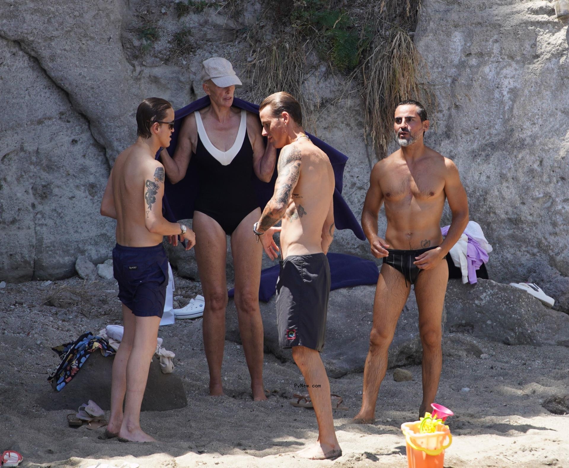Brigitte Nielsen wears a plunging black bathing suit in Italy