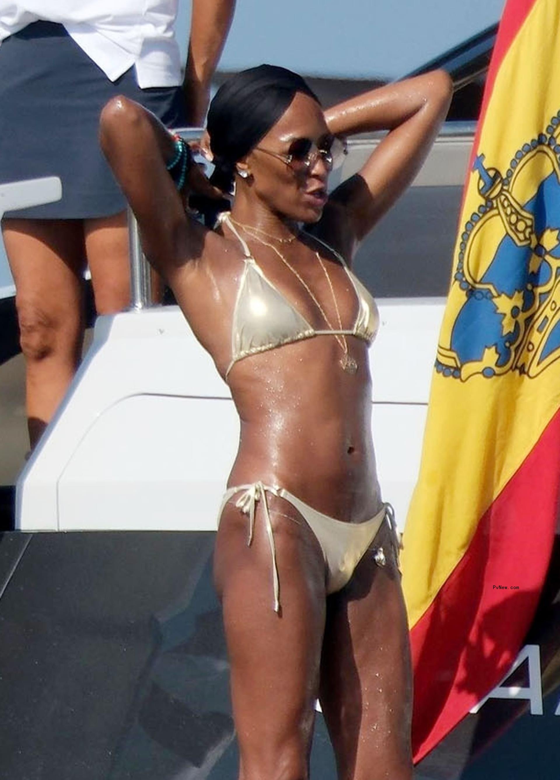 Naomi Campbell in a gold bikini.