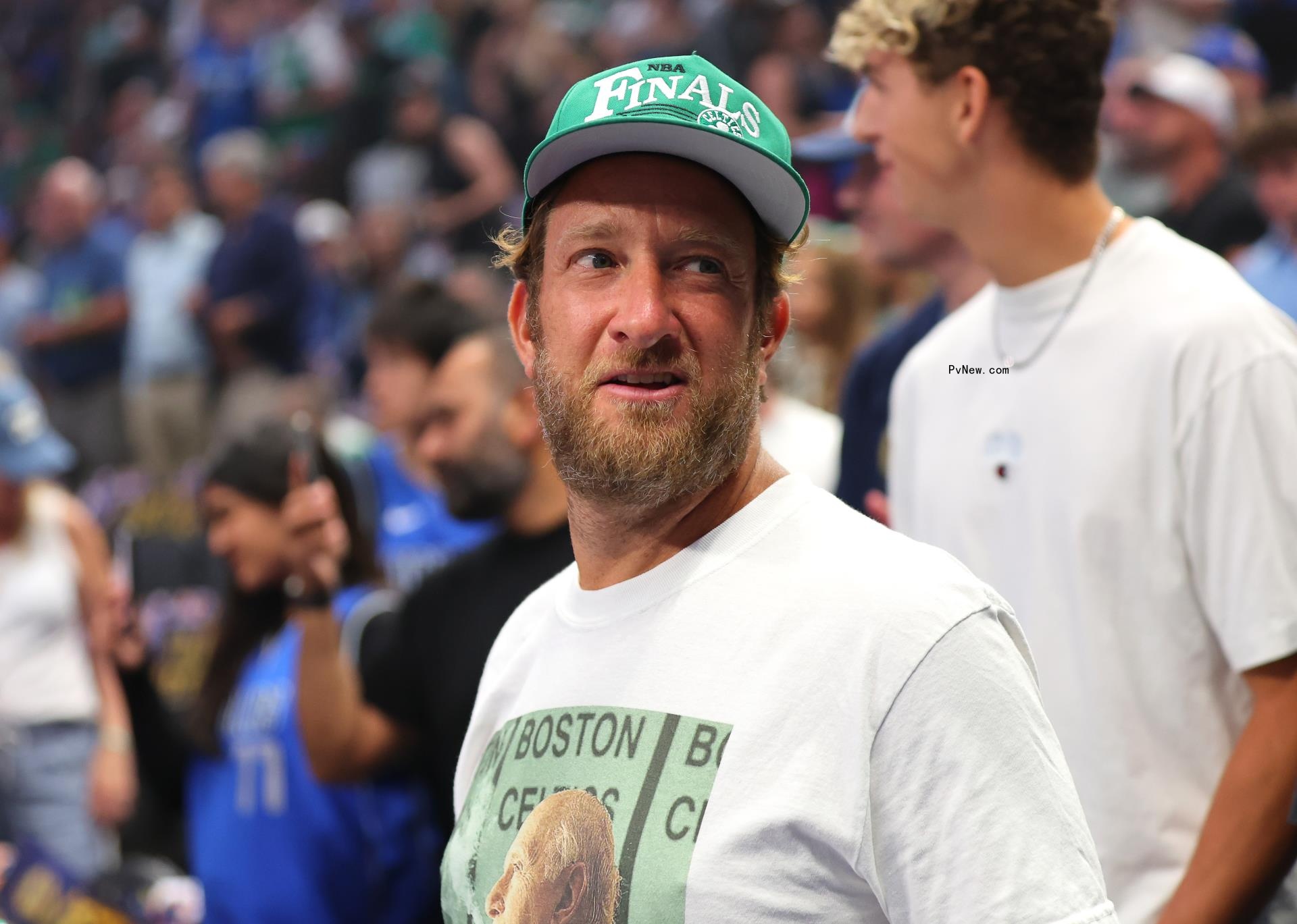 Dave Portnoy smiling at a basketball game