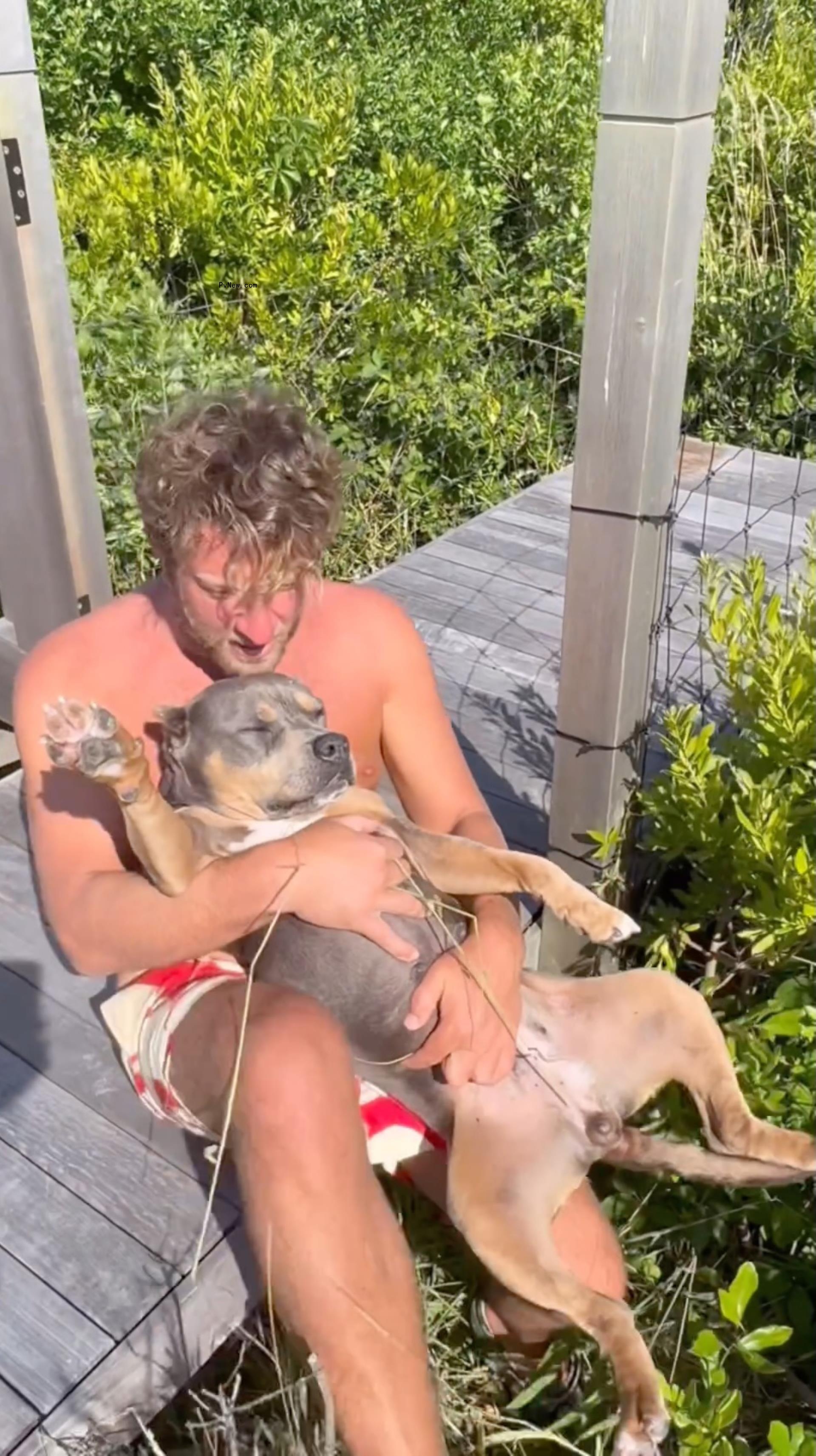 Dave Portnoy holding his dog