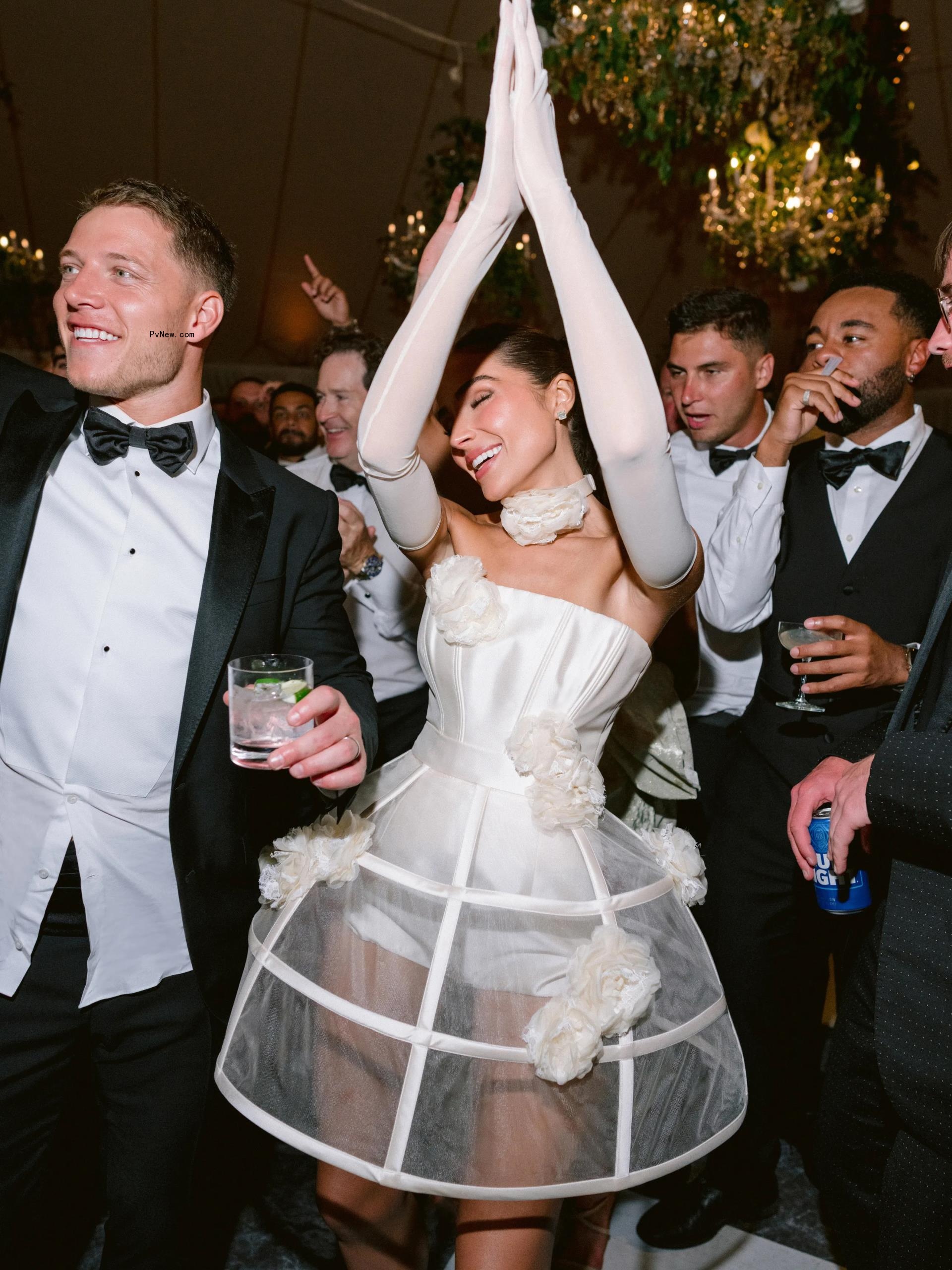 Olivia Culpo dancing in her afterparty wedding dress