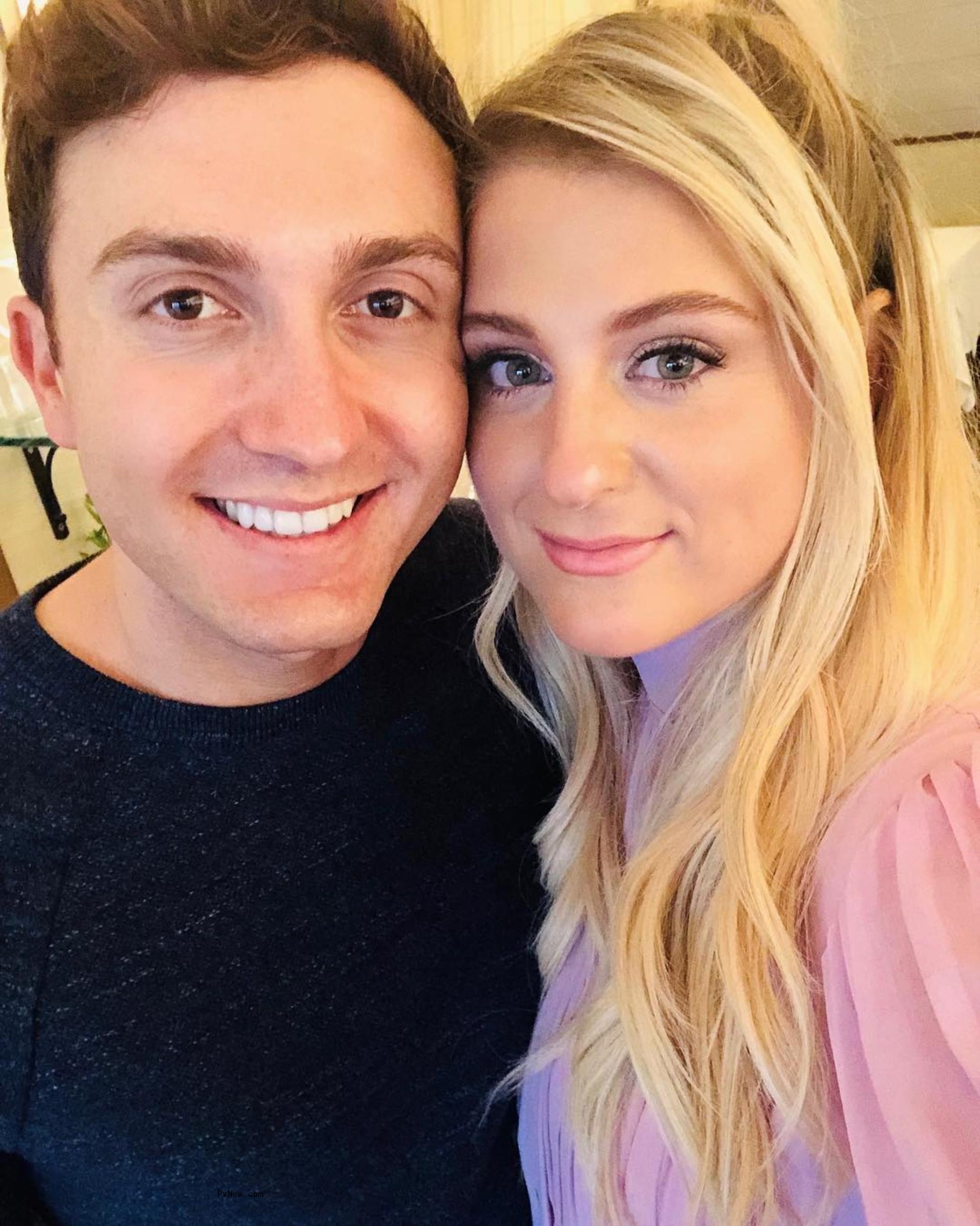 Daryl Sabara holding his sons.