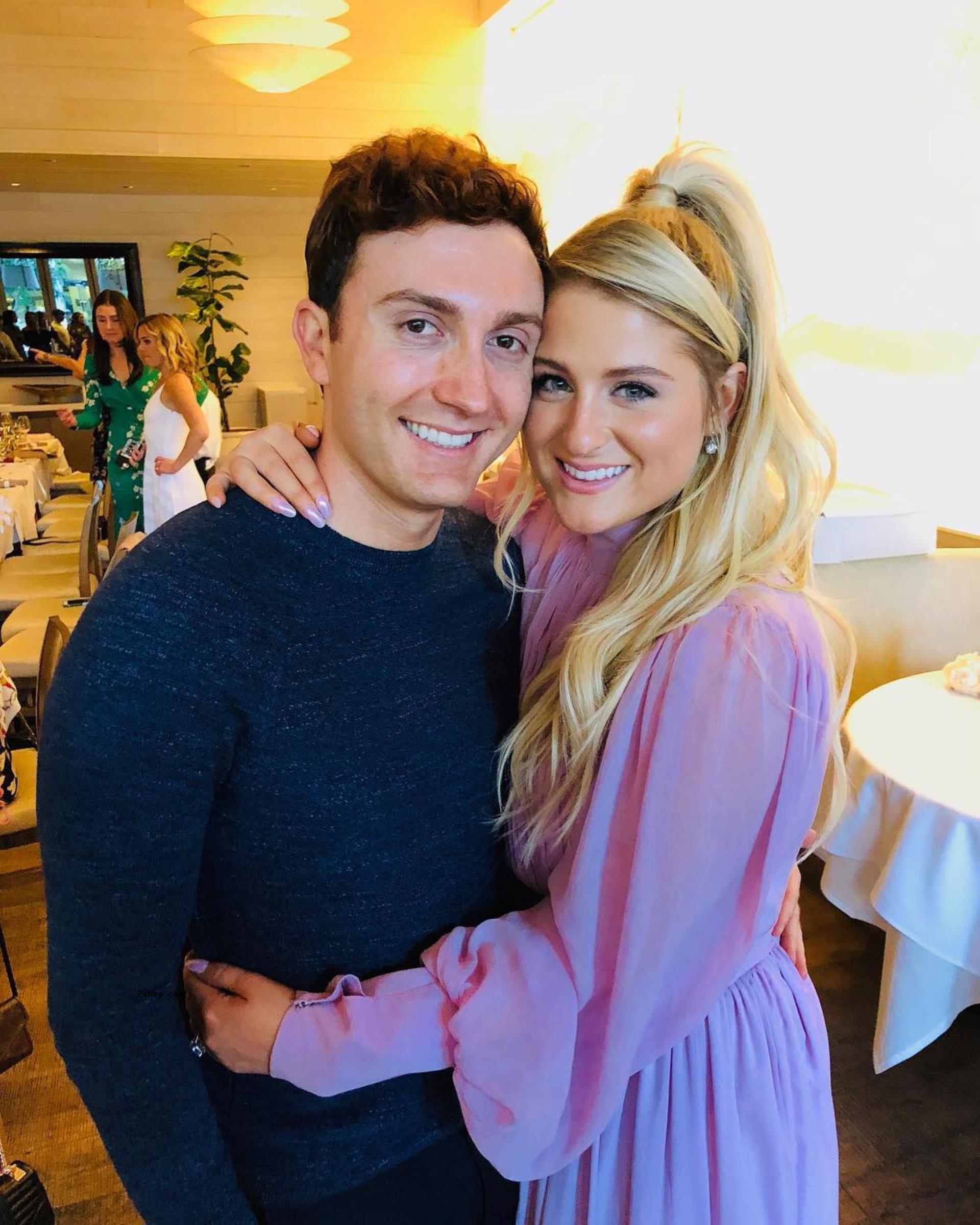 Meghan Trainor and Daryl Sabara hugging.
