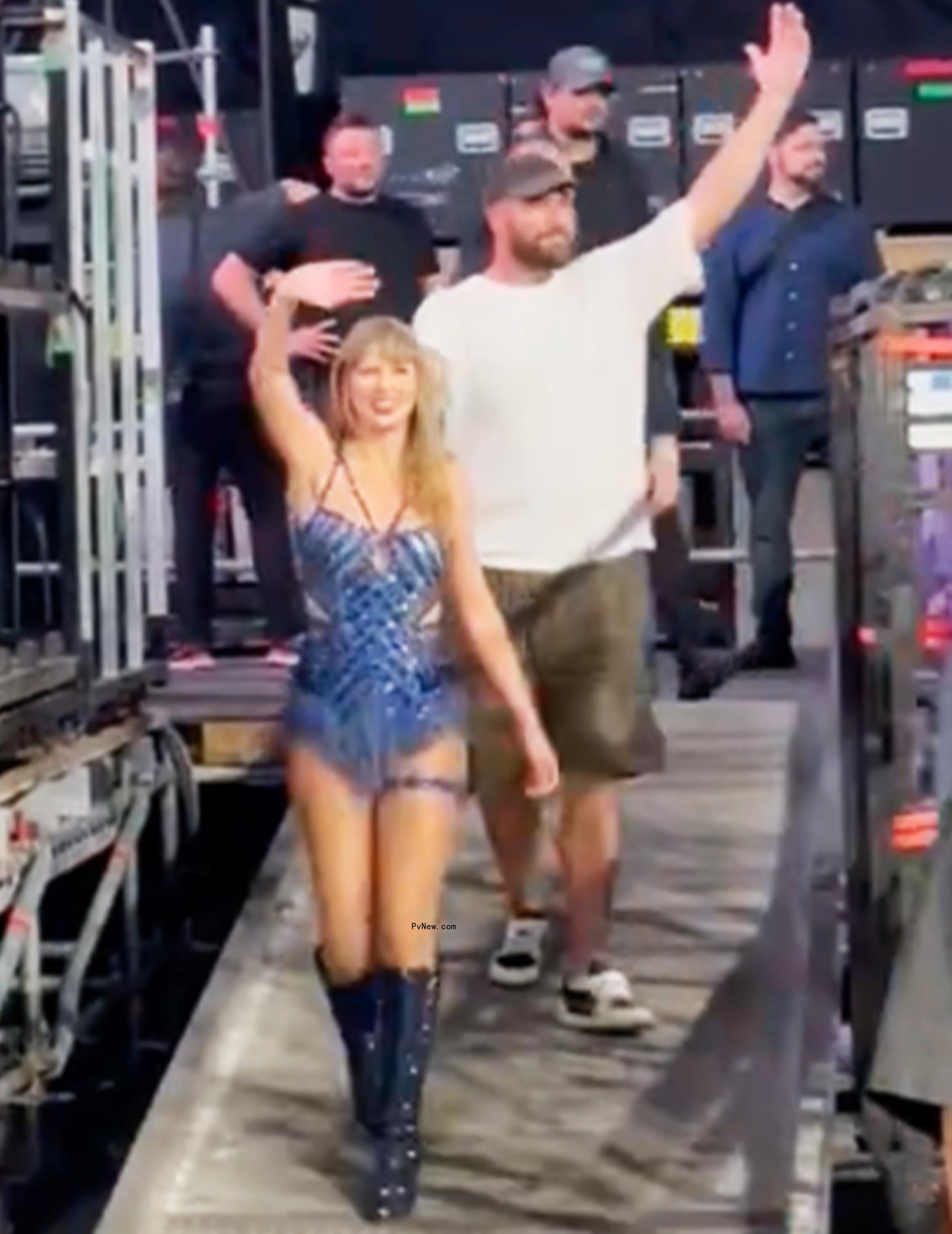 Taylor Swift and Travis Kelce waving to fans after her show.