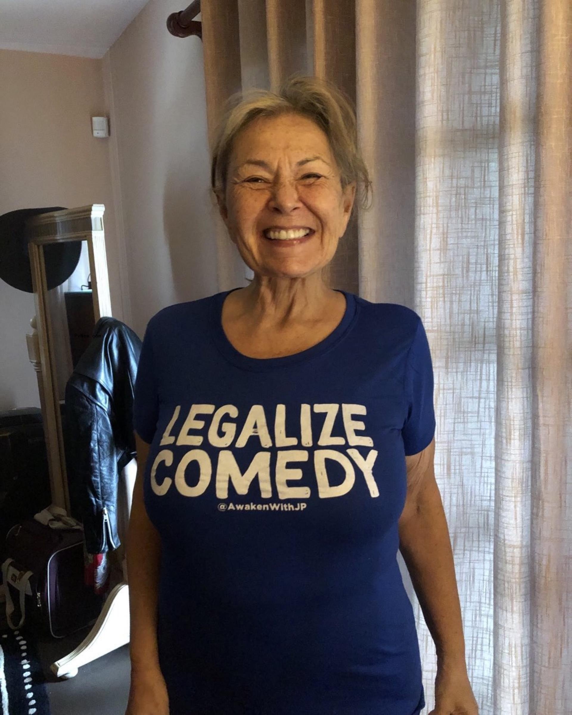 Roseanne Barr in a blue T-shirt.