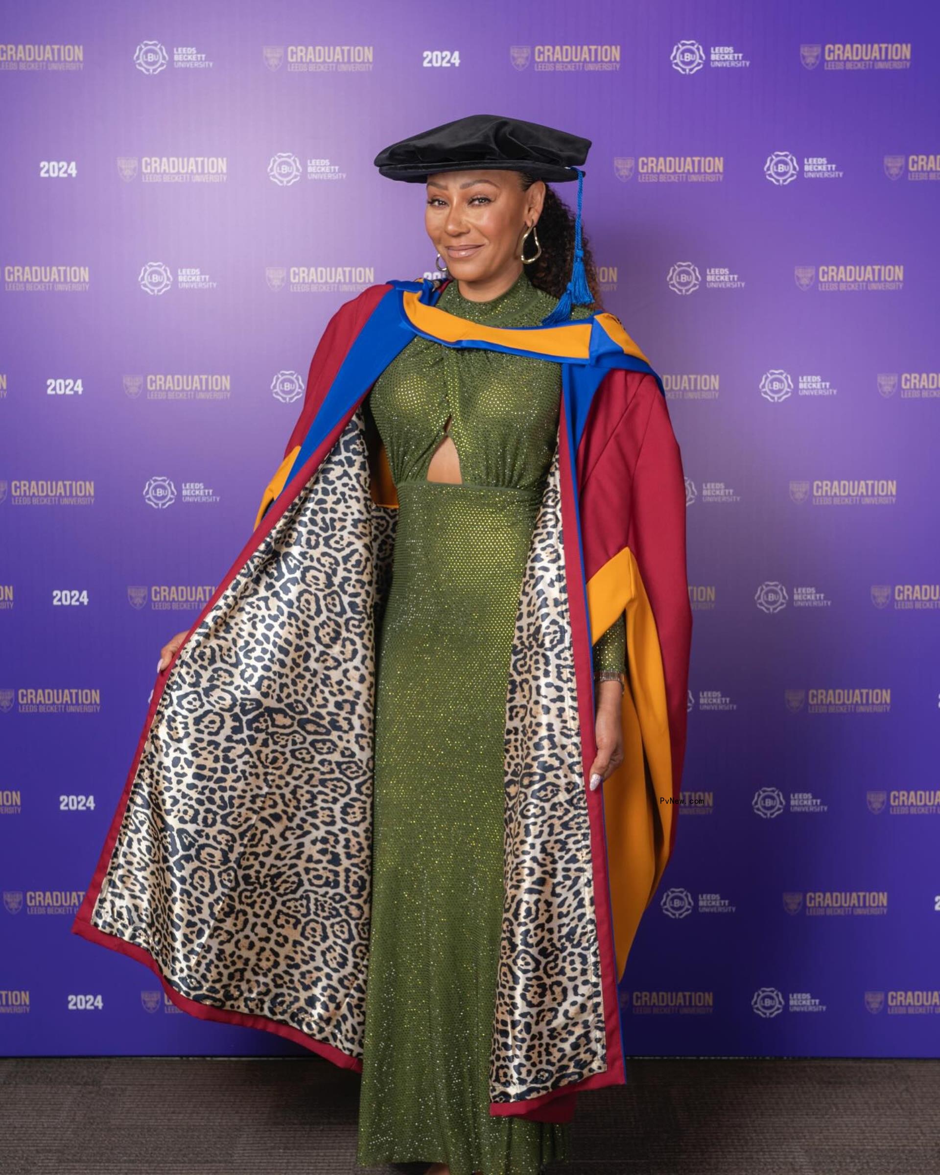 Mel B wearing a leopard print graduation gown