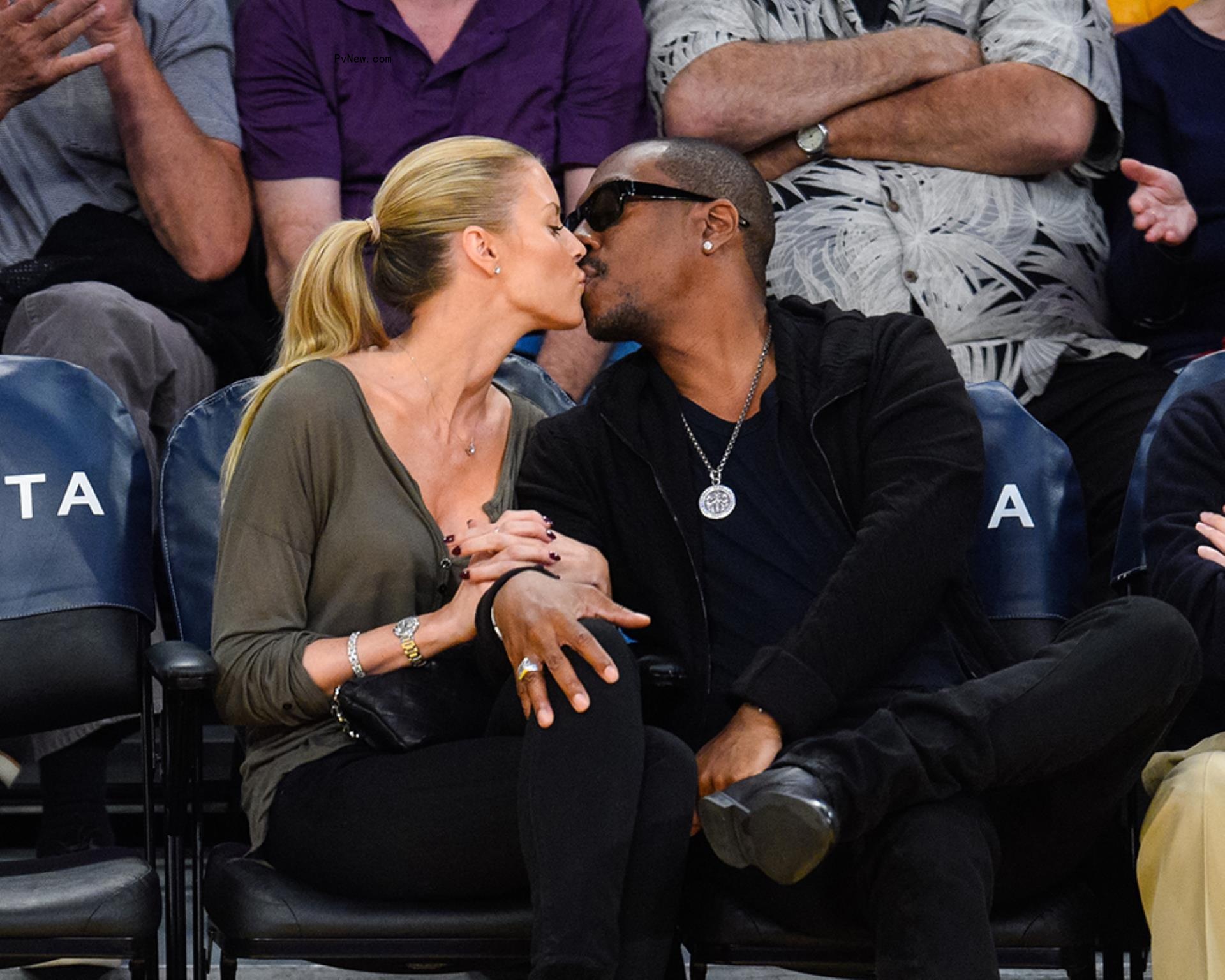 Paige Butcher and Eddie Murphy kissing