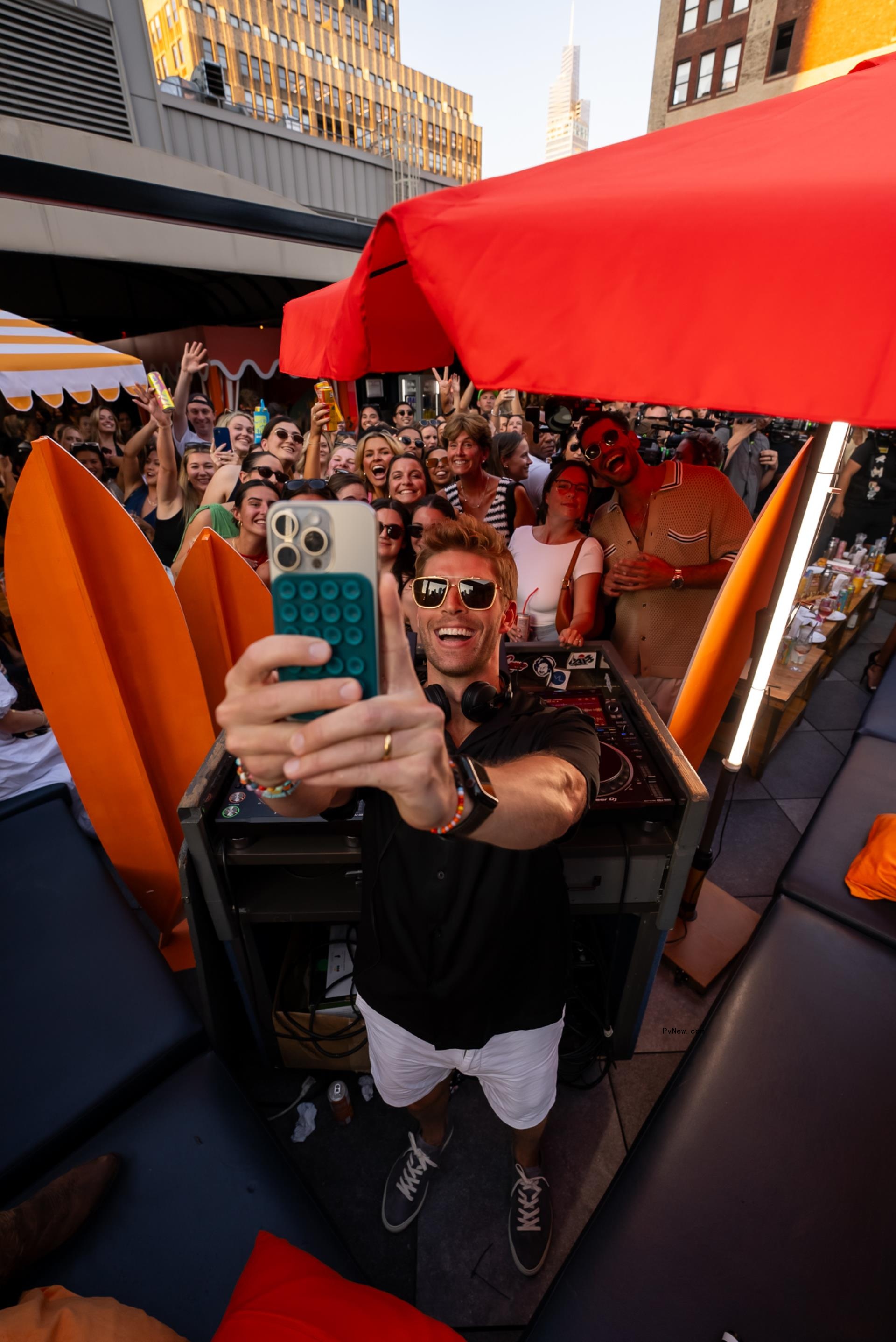 Kyle Cooke taking a selfie with fans