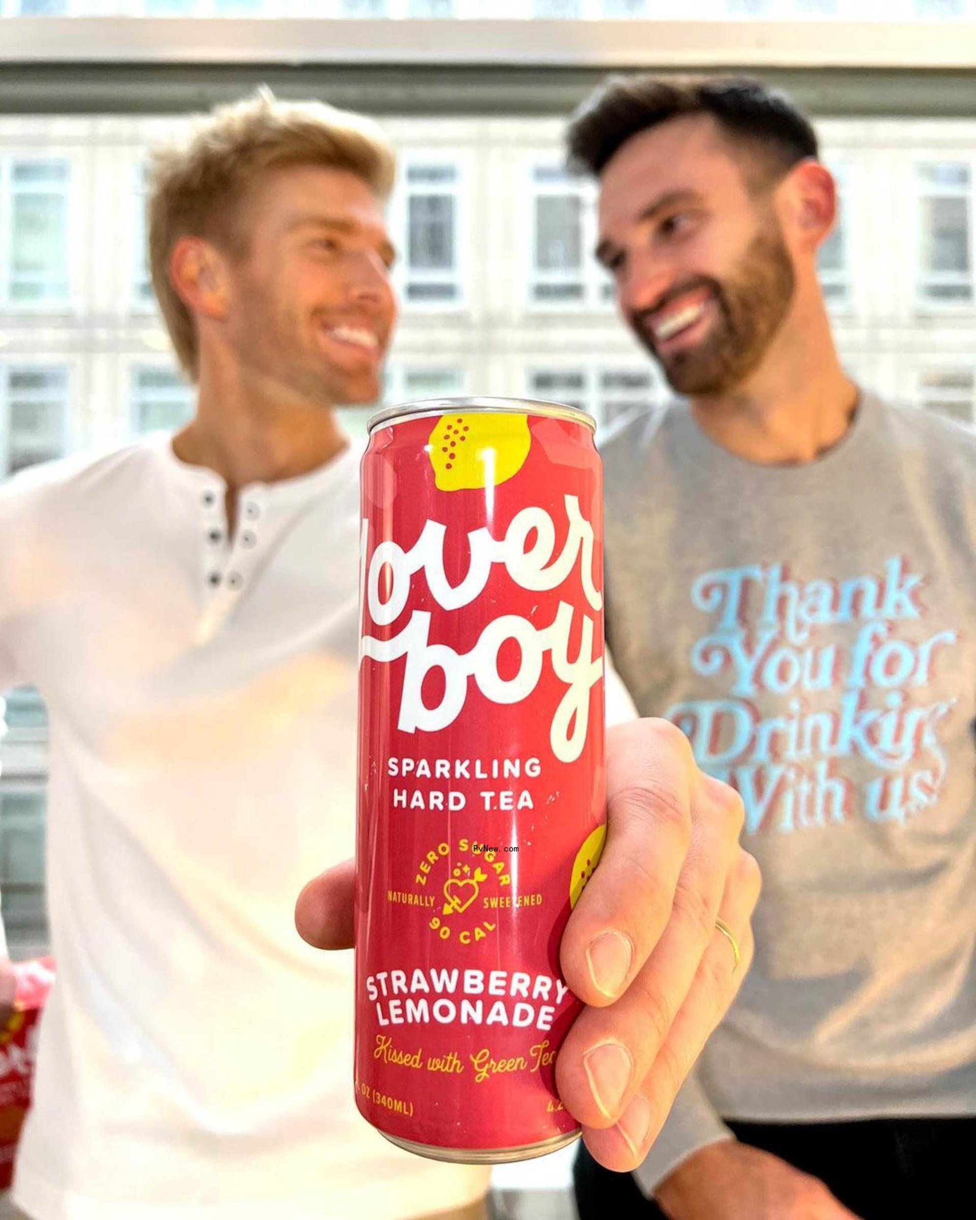 Kyle Cooke and Carl Radke holding a Loverboy