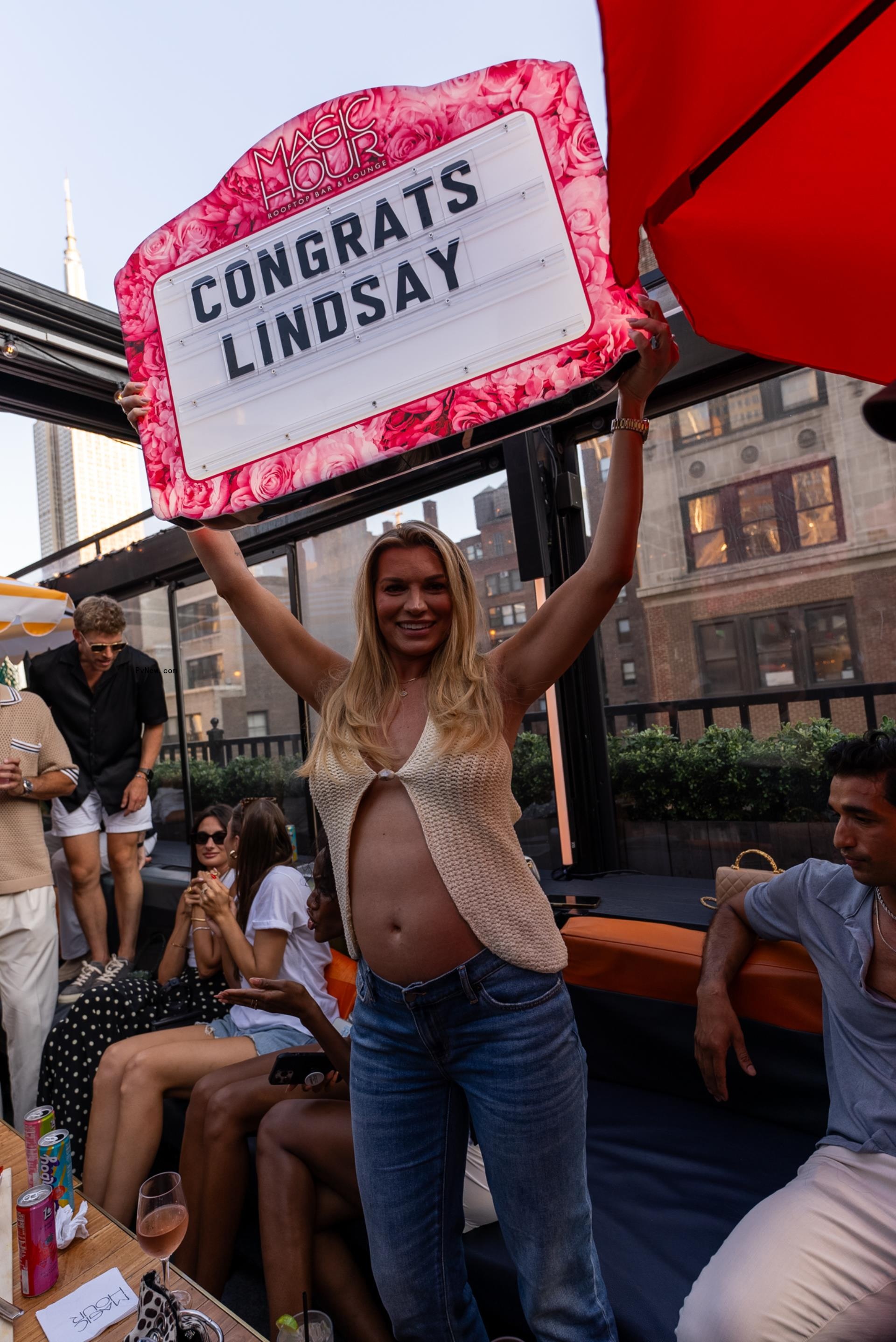 Lindsay Hubbard holding a sign