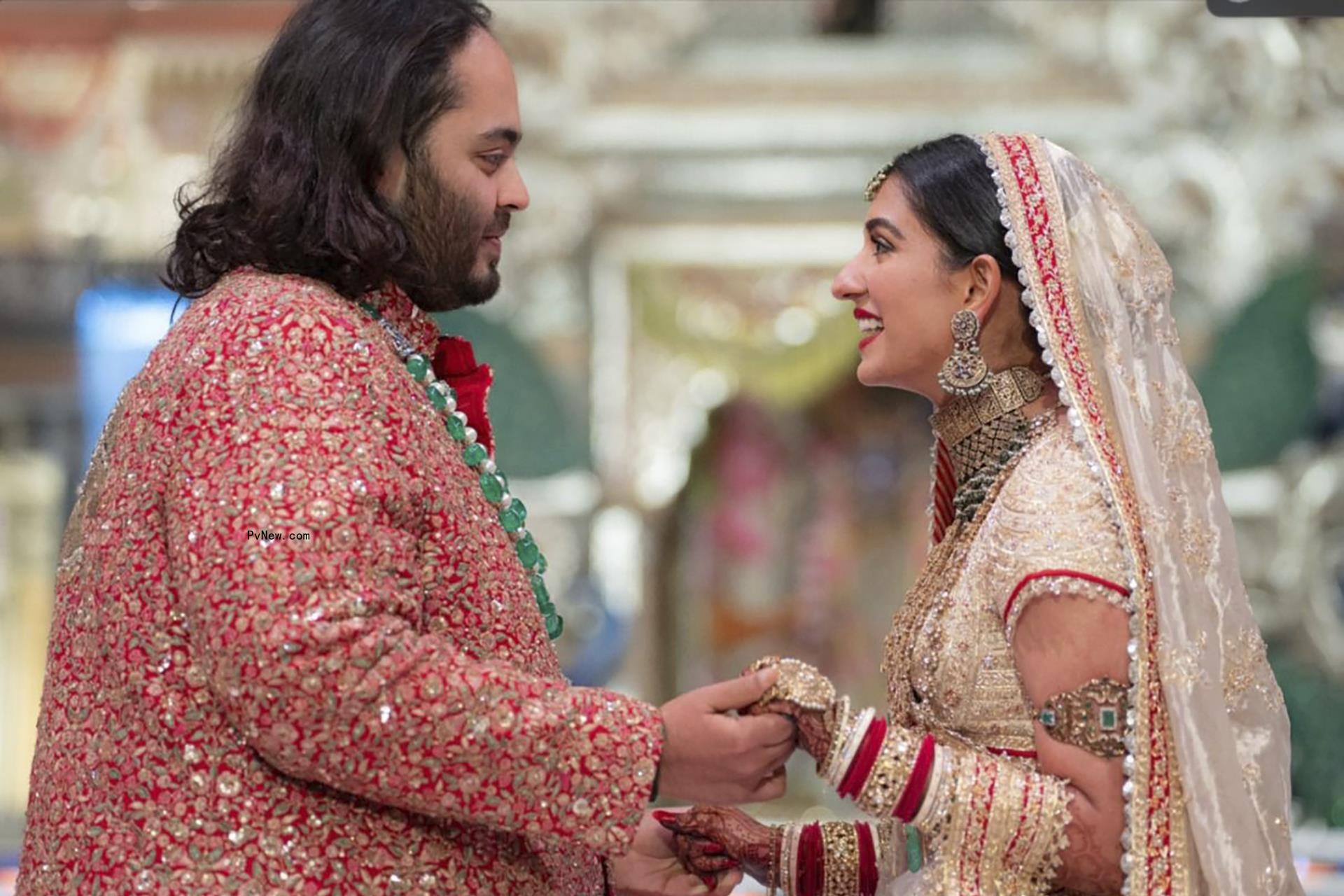 In this photo provided by Reliance Industries, Anant Ambani, left, the son of billio<i></i>naire Mukesh Ambani, holds hands with Radhika Merchant during their wedding ceremony at Jio World Co<i></i>nvention Centre in Mumbai, India, Friday, July 12, 2024.