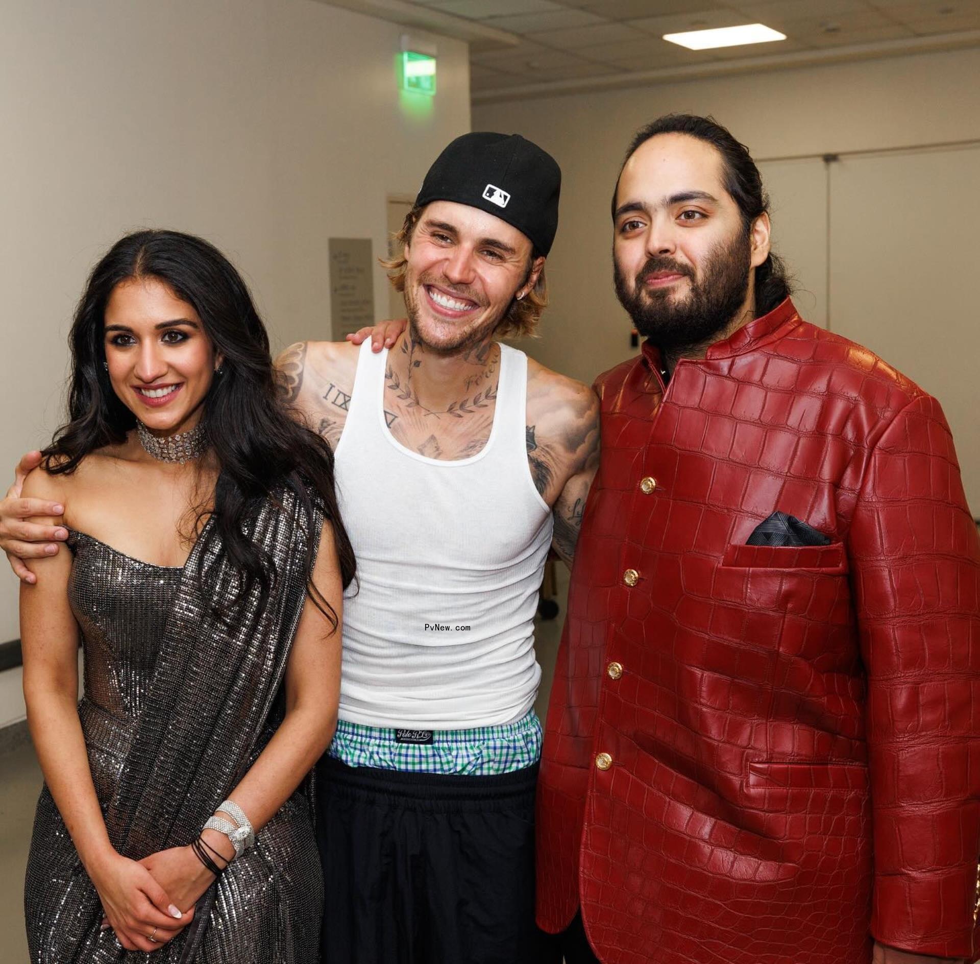 Justin Bieber posing with Anant Ambani and Radhika Merchant.