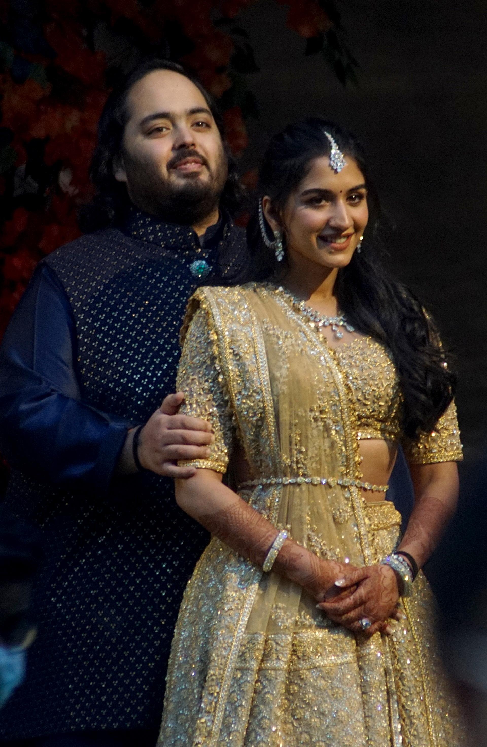 Anant Ambani and Radhika Merchant smiling together.