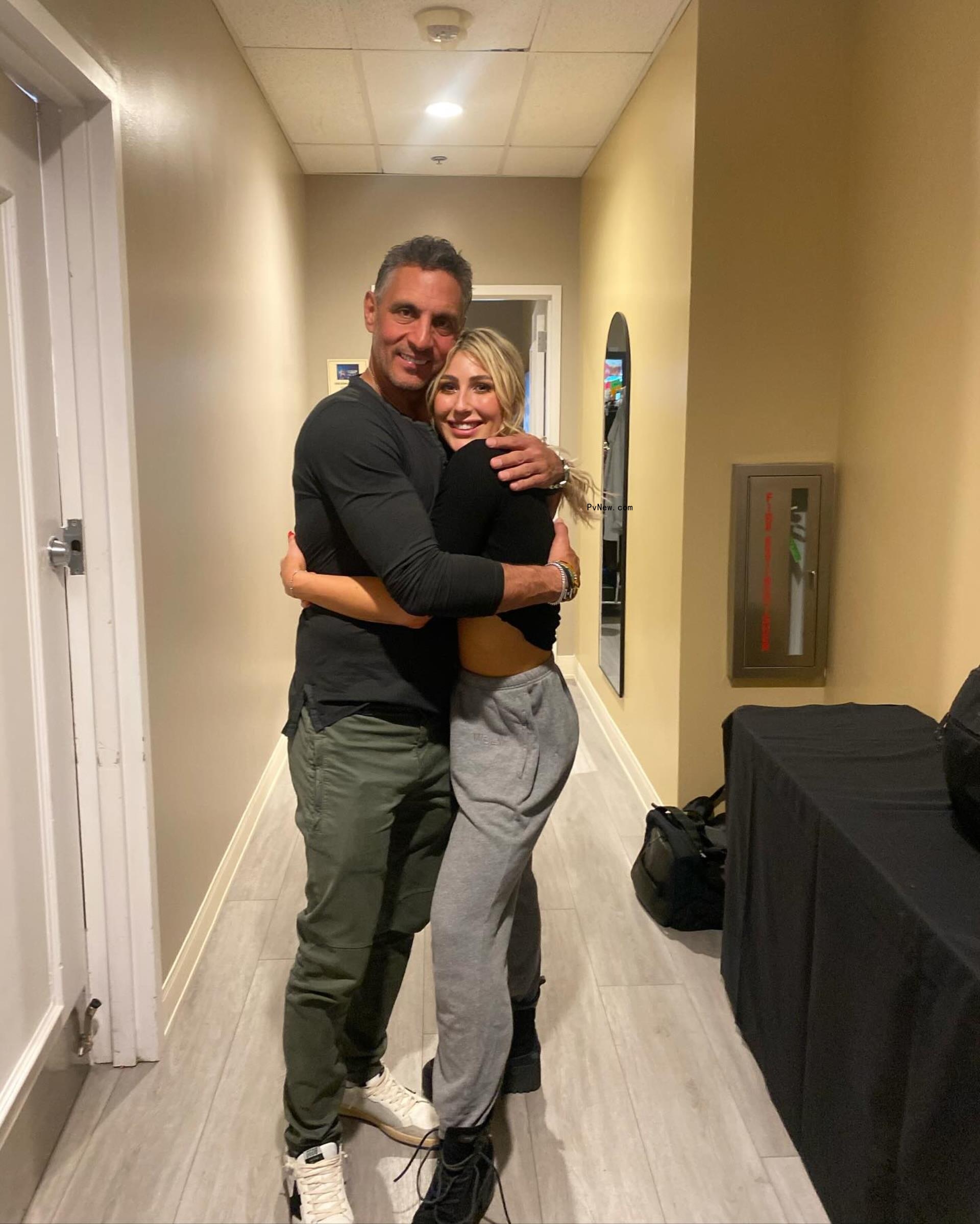 Emma Slater and Mauricio Umansky posing together
