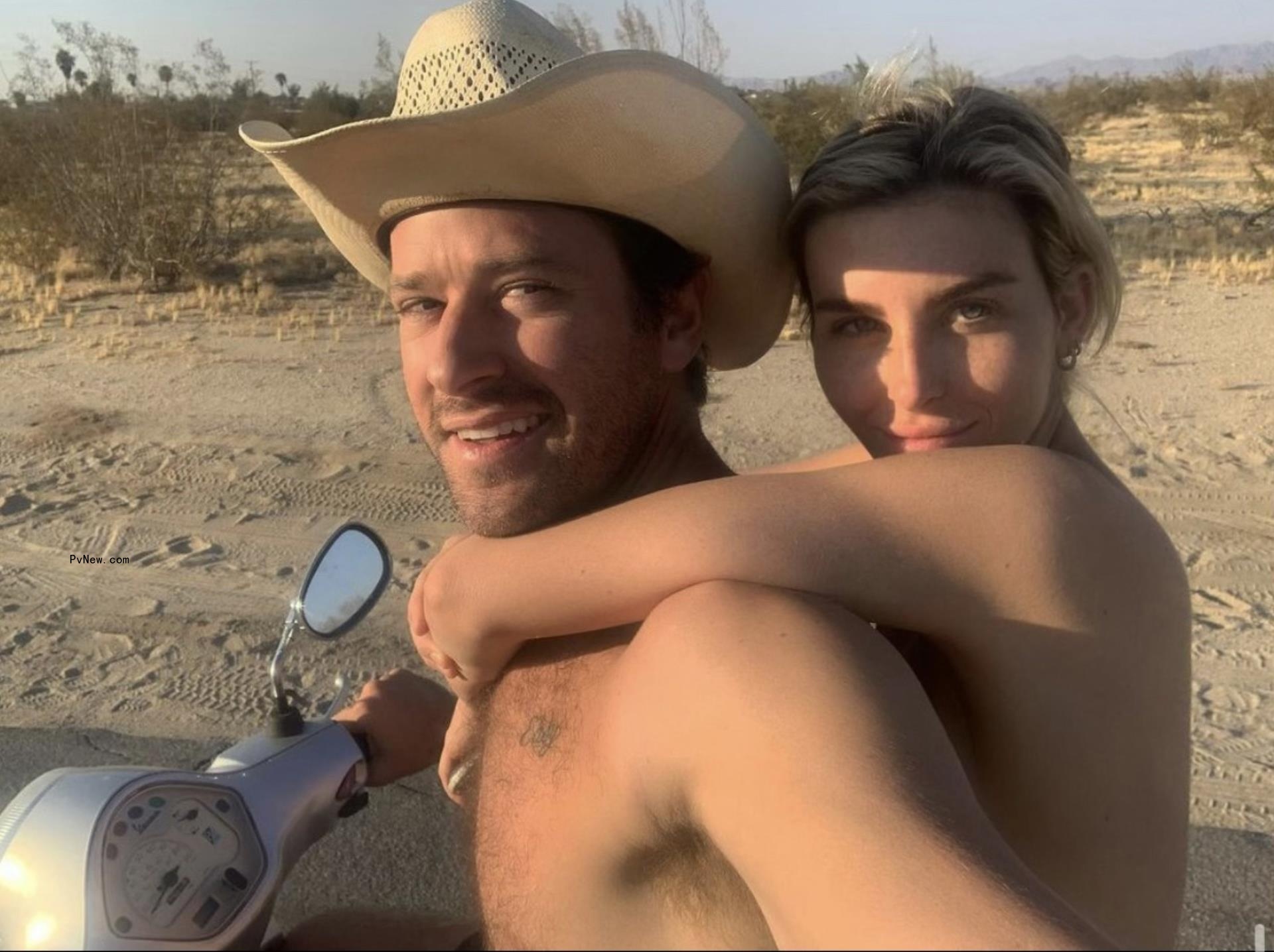 Armie Hammer and Paige Lorenze at the beach.
