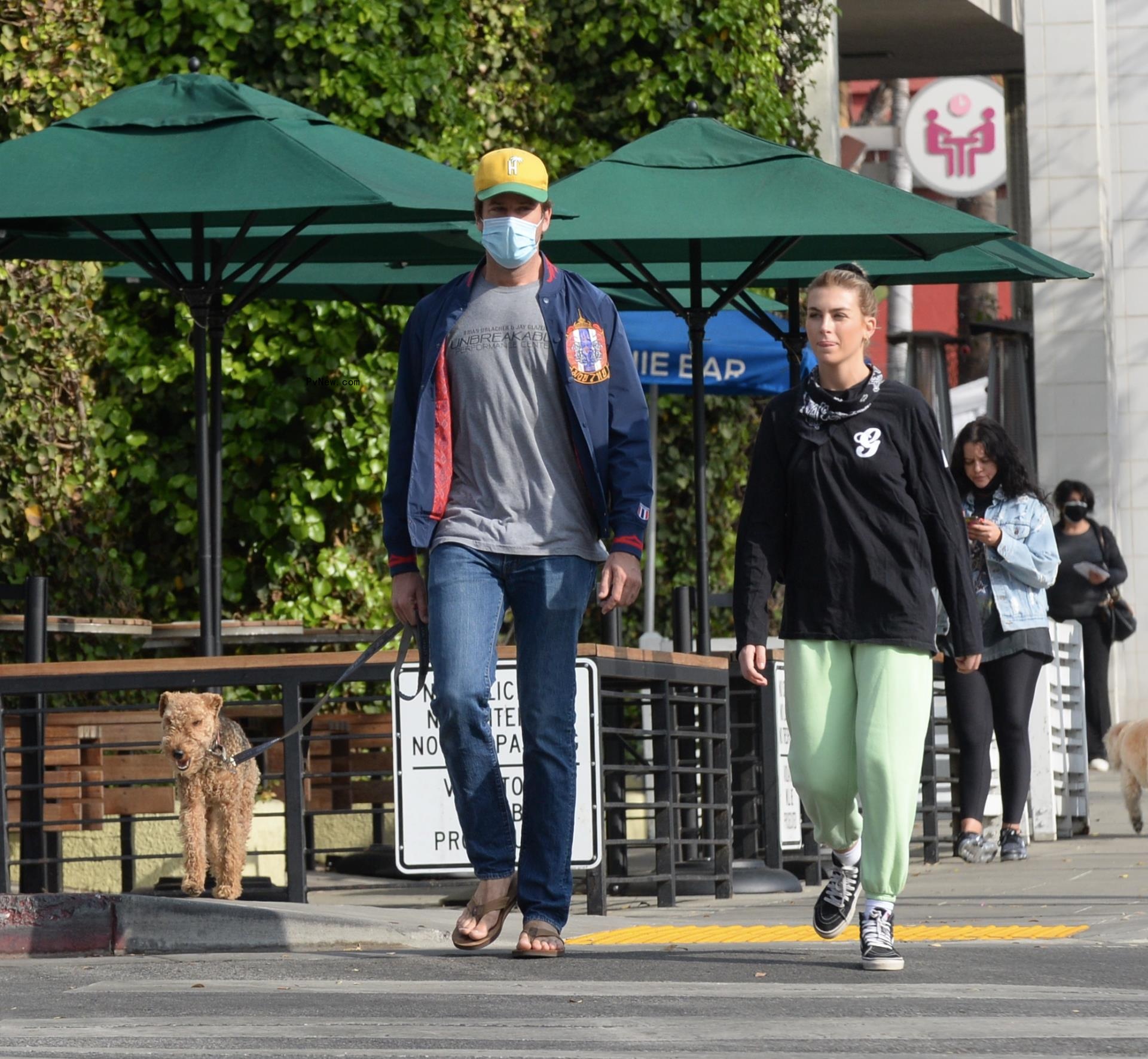 Armie Hammer and Paige Lorenze on a walk.