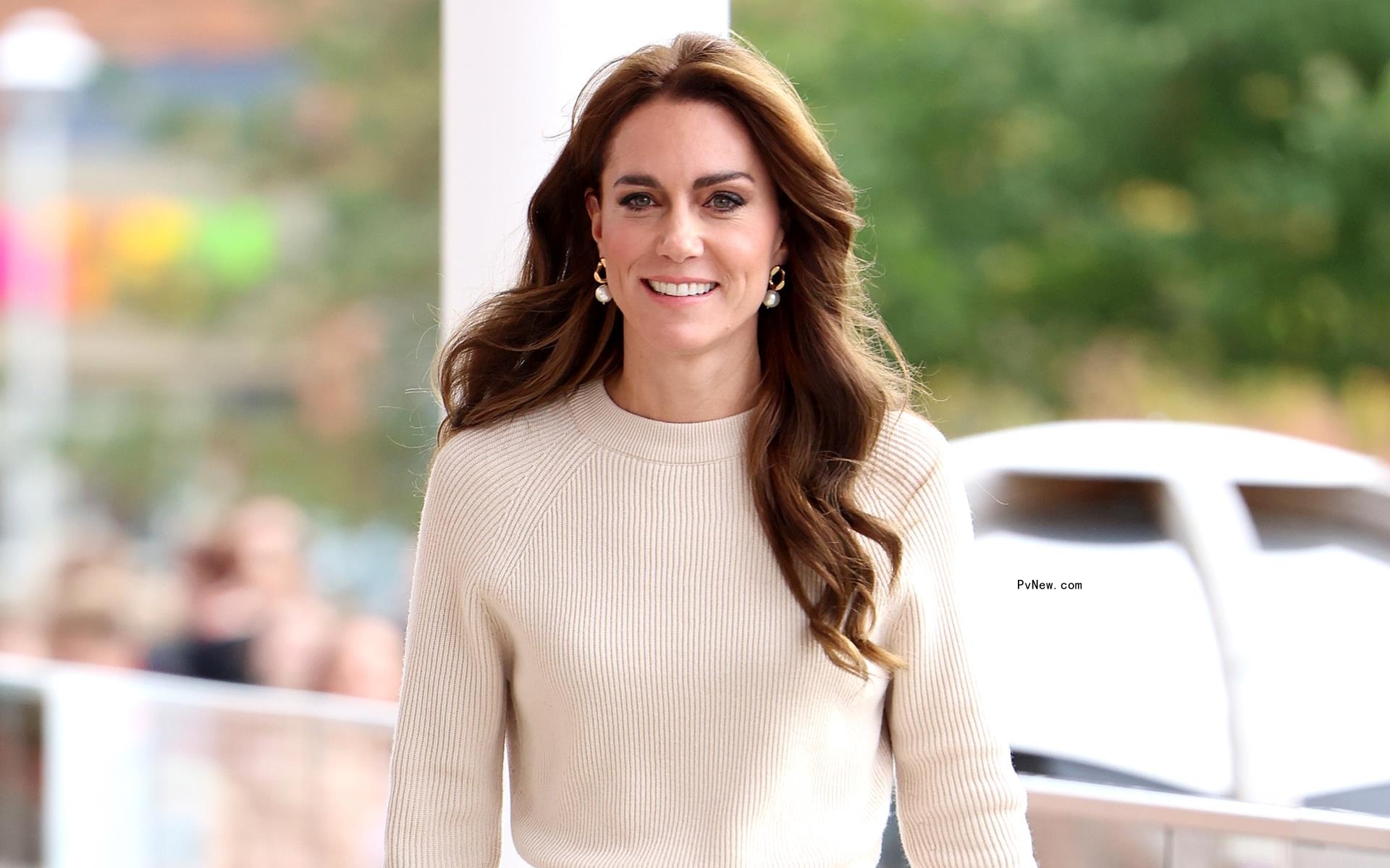 Kate Middleton in a beige dress.