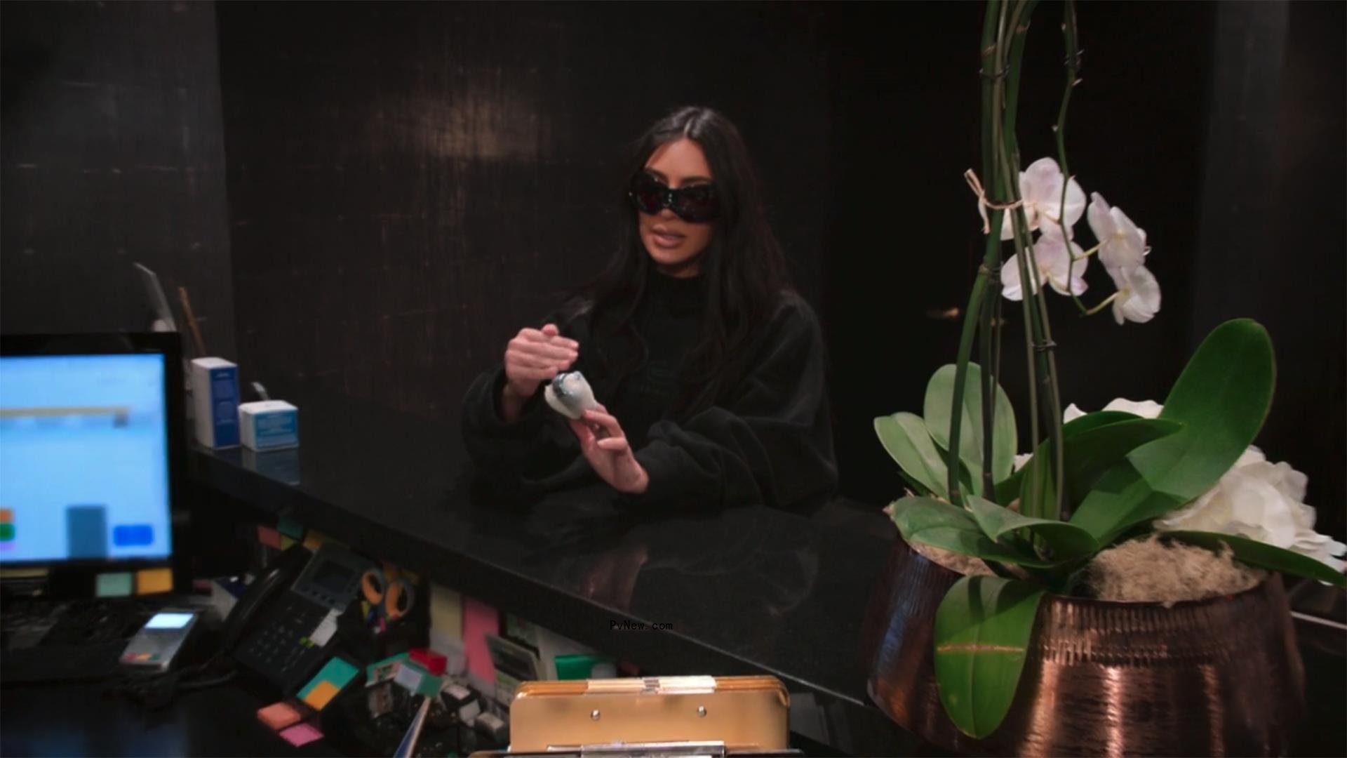 Kim Kardashian wearing bandages on her fingers.