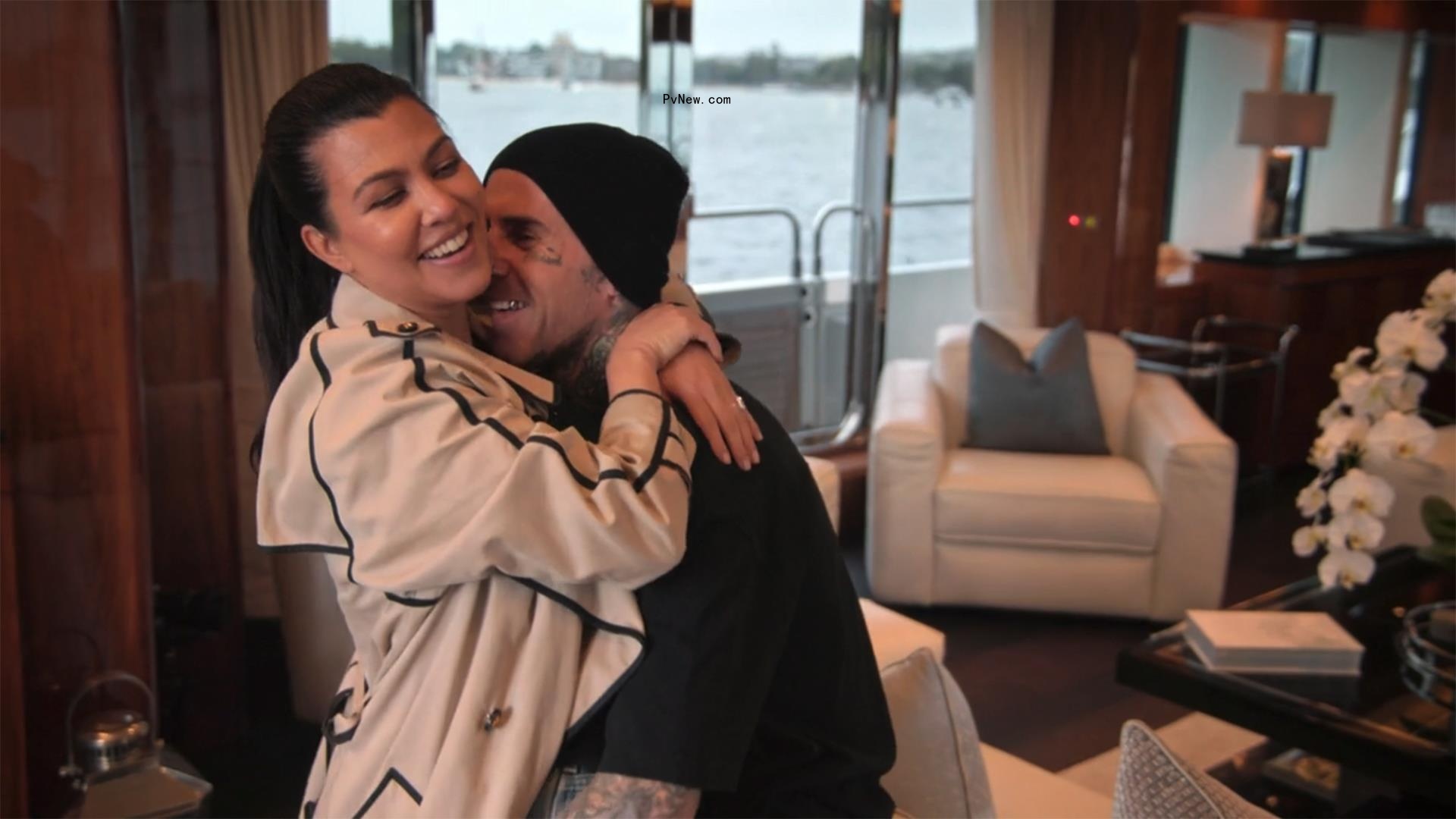 Kourtney Kardashian and Travis Barker making out on a yacht. 