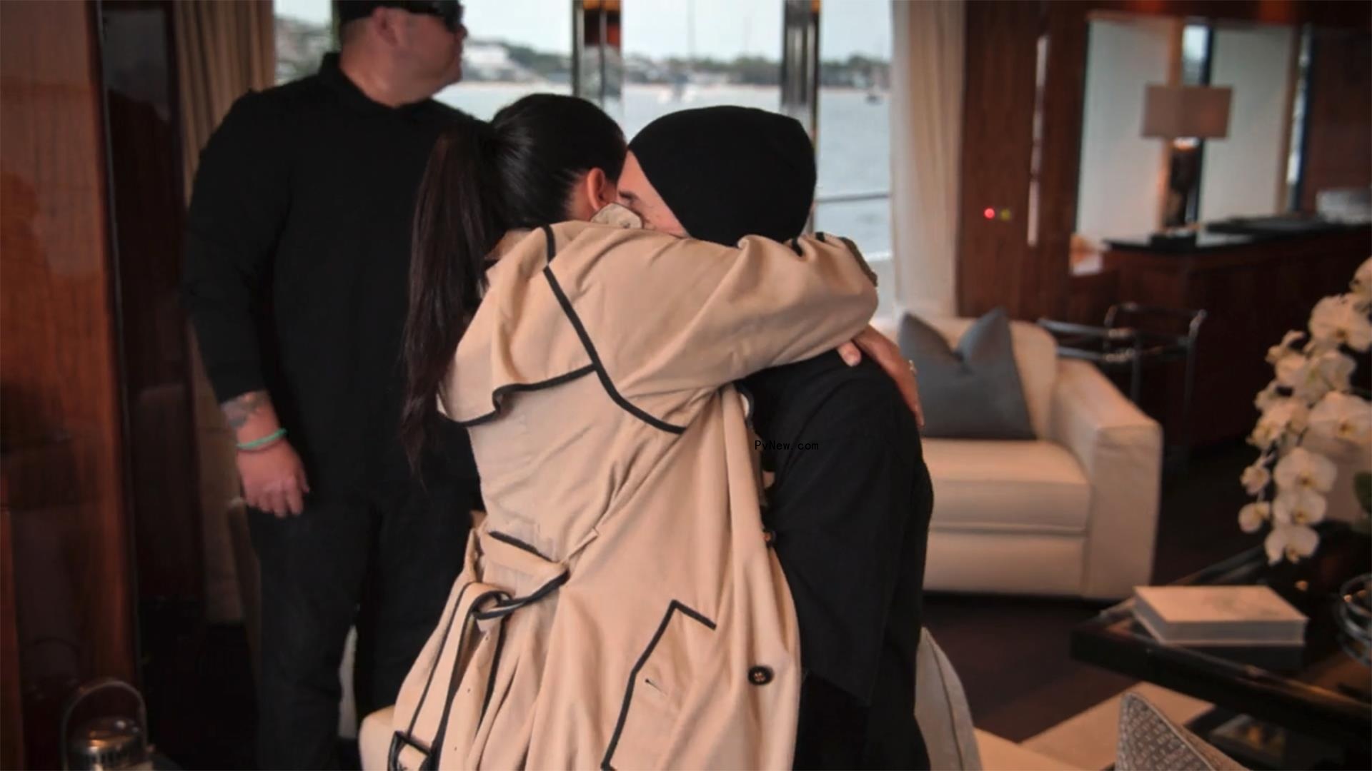 Kourtney Kardashian and Travis Barker making out on a yacht. 