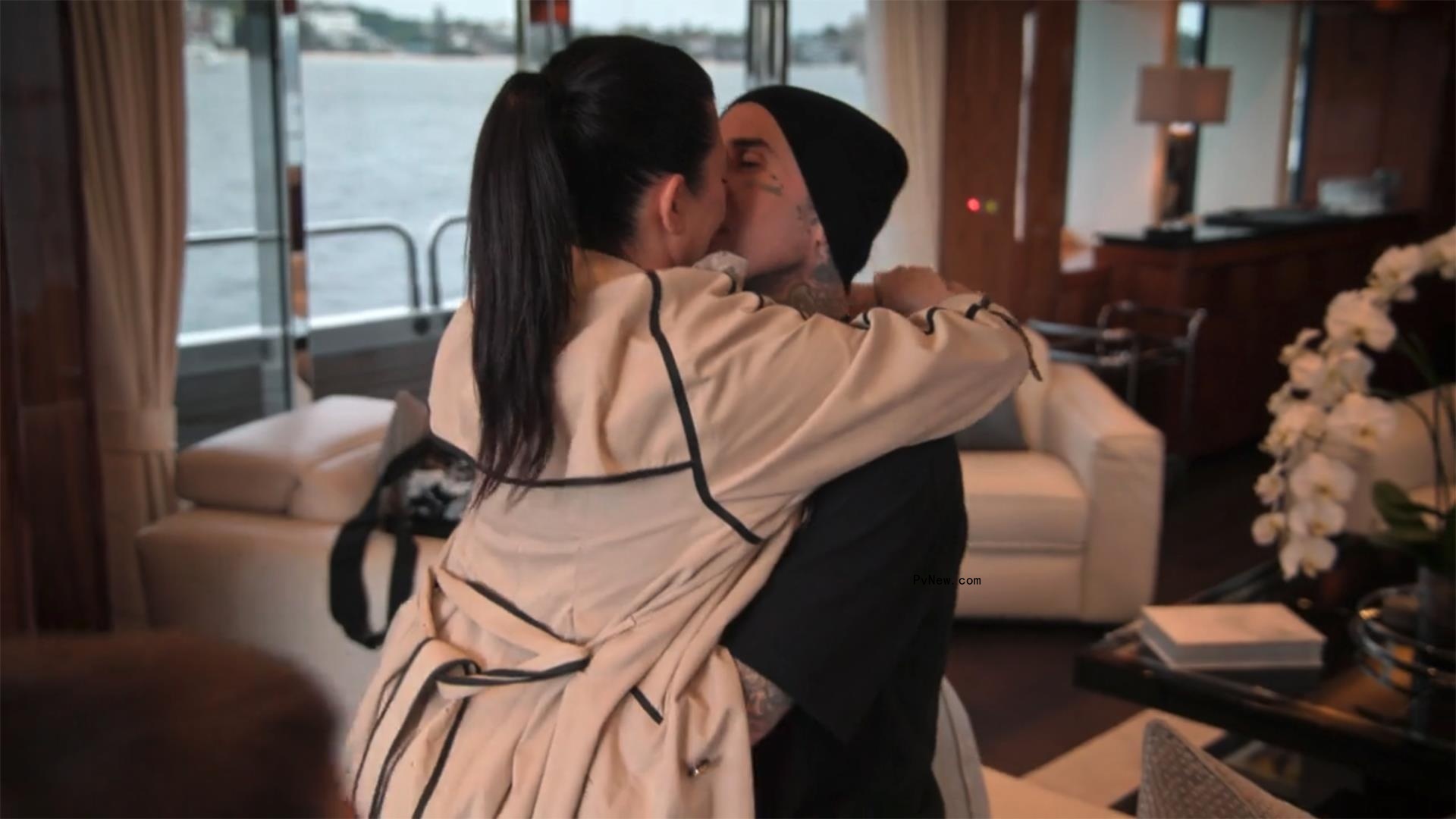 Kourtney Kardashian and Travis Barker making out on a yacht. 